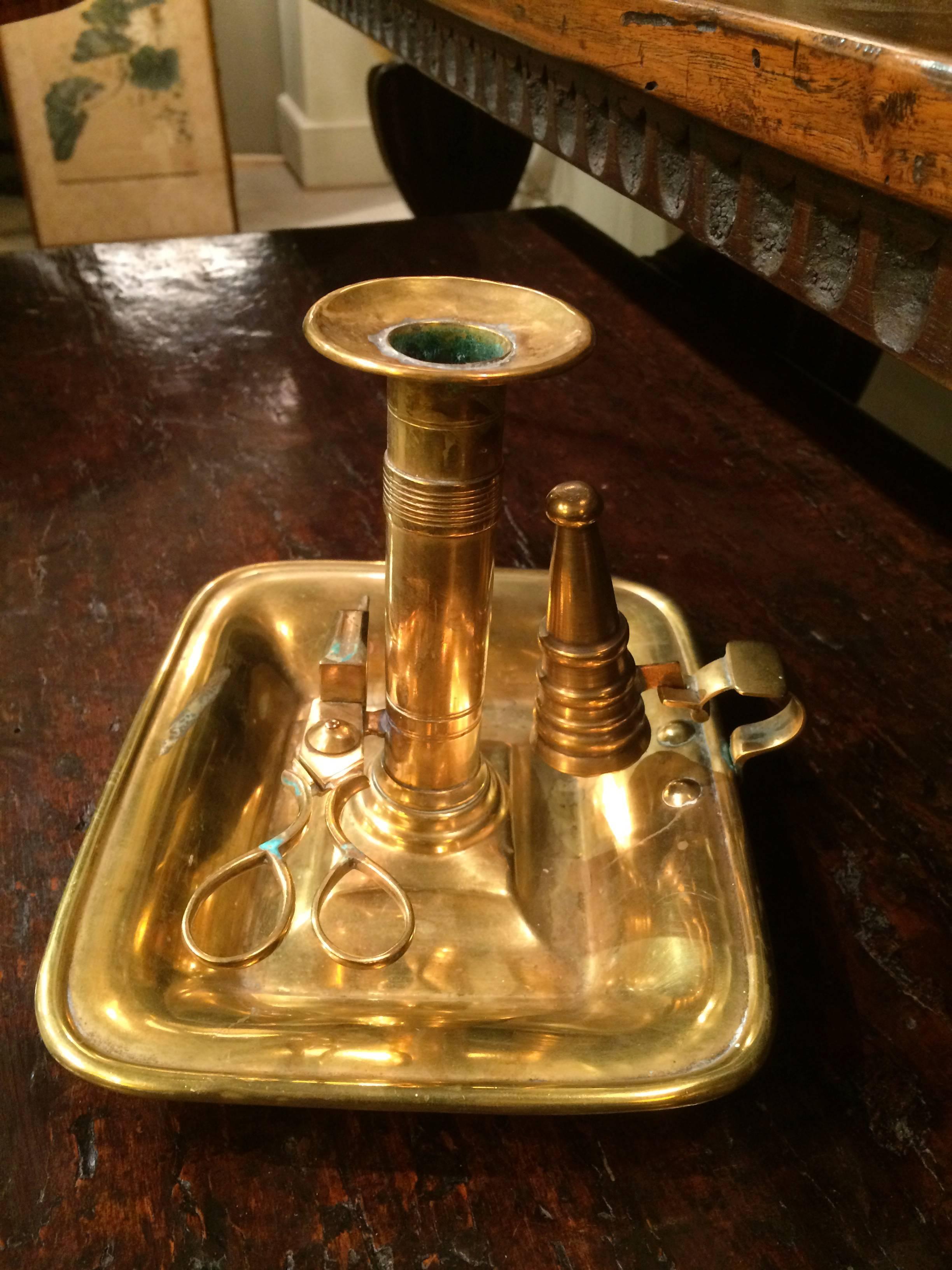 English Brass Deep Dish Chamberstick with original snuffer and spring loaded douter, circa 1820. 