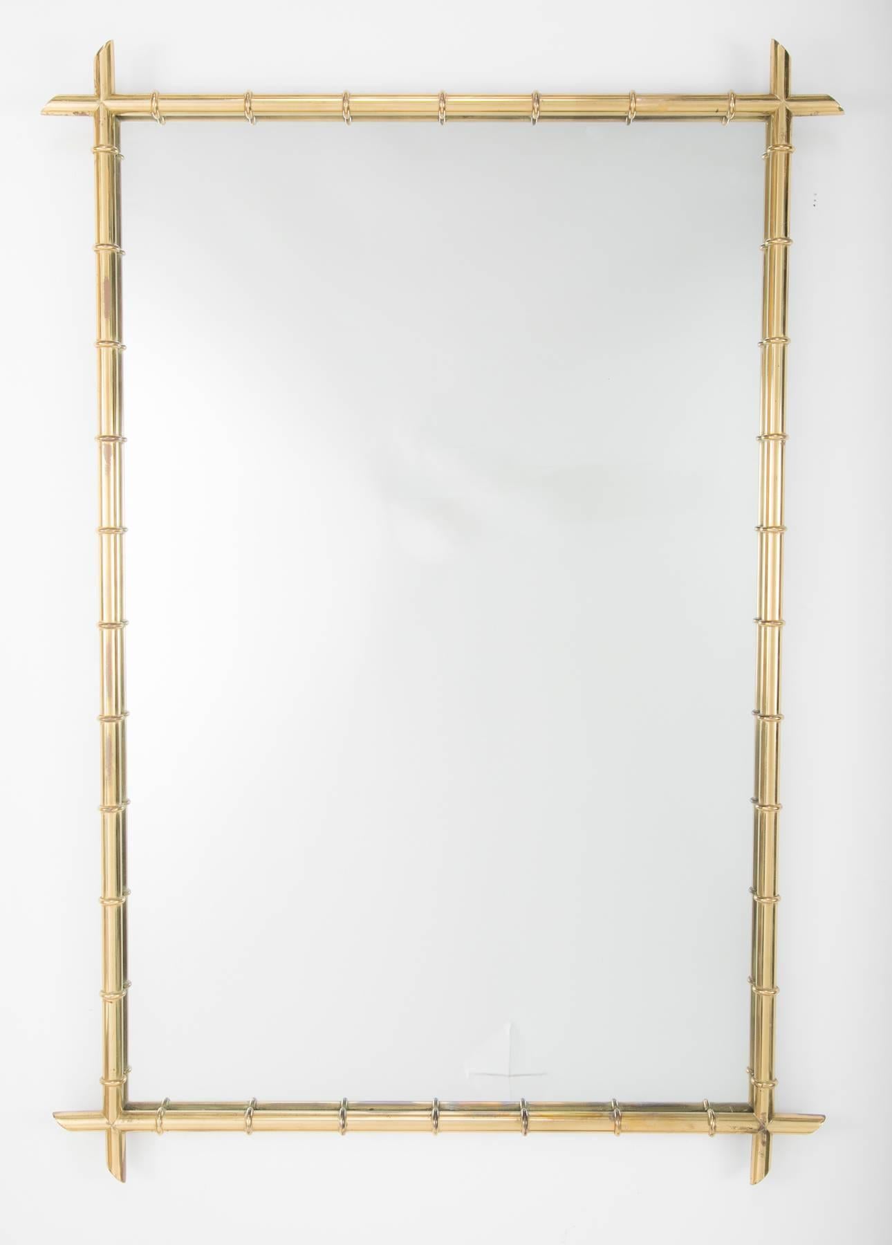Hollywood Regency faux bamboo brass mirror in the style of Billy Haines. Good scale, 4 feet by 33 inches. 