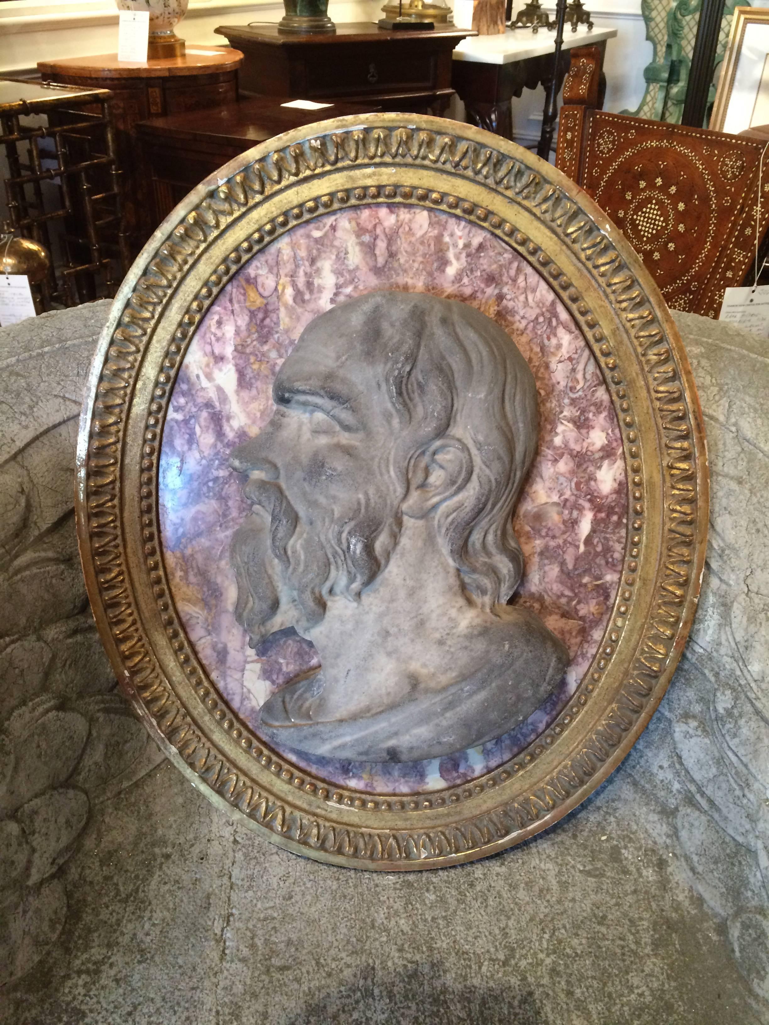 18th century Italian marble relief portrait of the Roman Stoic philosopher Seneca, carved in deep relief and mounted on a red and white variegated marble oval. In a 19th century neoclassical style gilt wood frame.