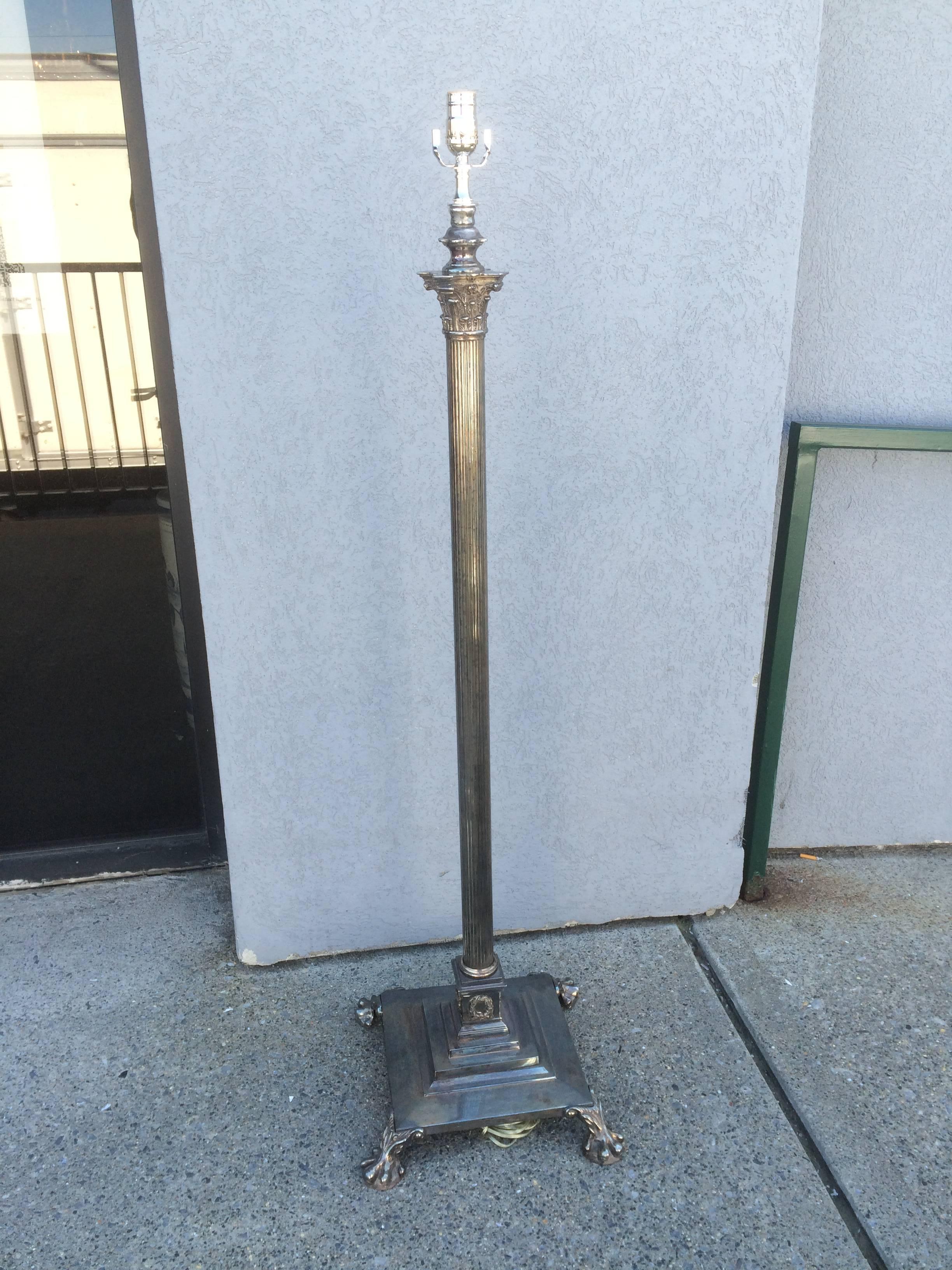 English Regency silver plated floor lamp in the form of a neoclassical fluted column topped by a Corinthian capital on a square stepped pedestal base supported by four paw feet. Converted from an oil lamp, all new wiring.