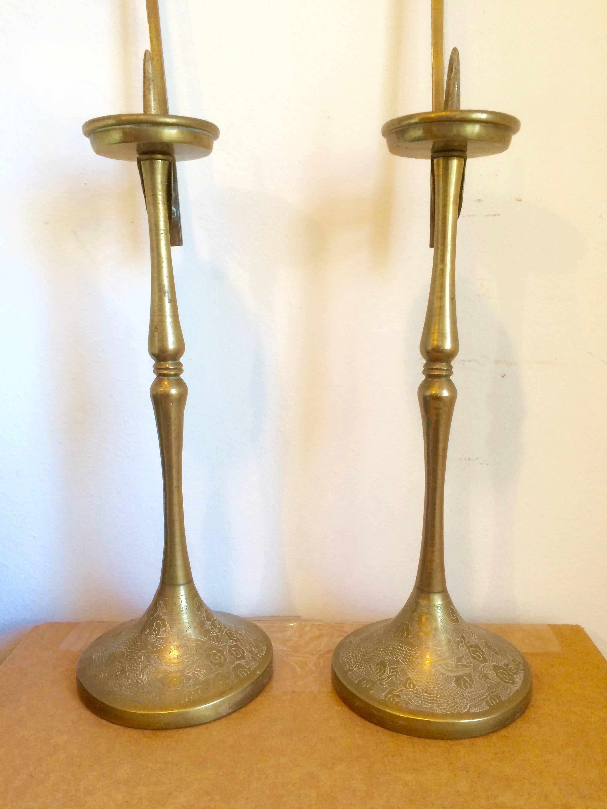 Pair of 19th century Korean, Choson brass candlesticks with etched decoration and butterfly reflectors. The candlesticks come apart into four sections.

Provenance: Luther Carrington Goodrich, 1894-1984. An American sinologist and historian of