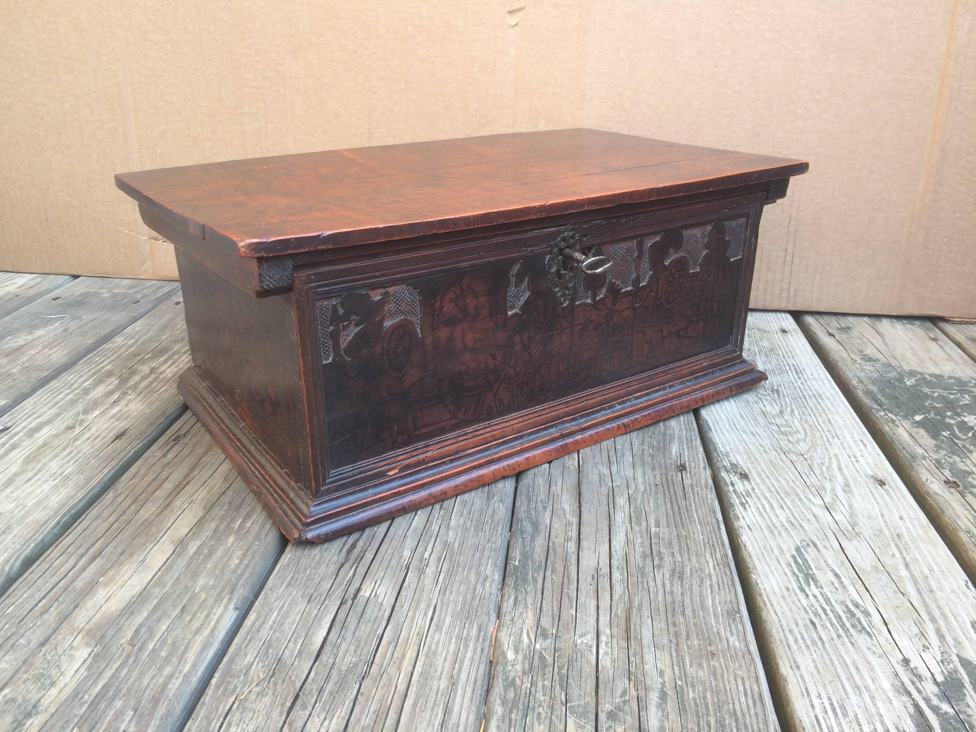 A fine 16th century Italian cypress wood joined tabletop chest, the hinged top enclosing the original interior compartments and secret drawers. Inside and out decorated with penwork scenes of David slaying Goliath. The interior penwork wonderfully