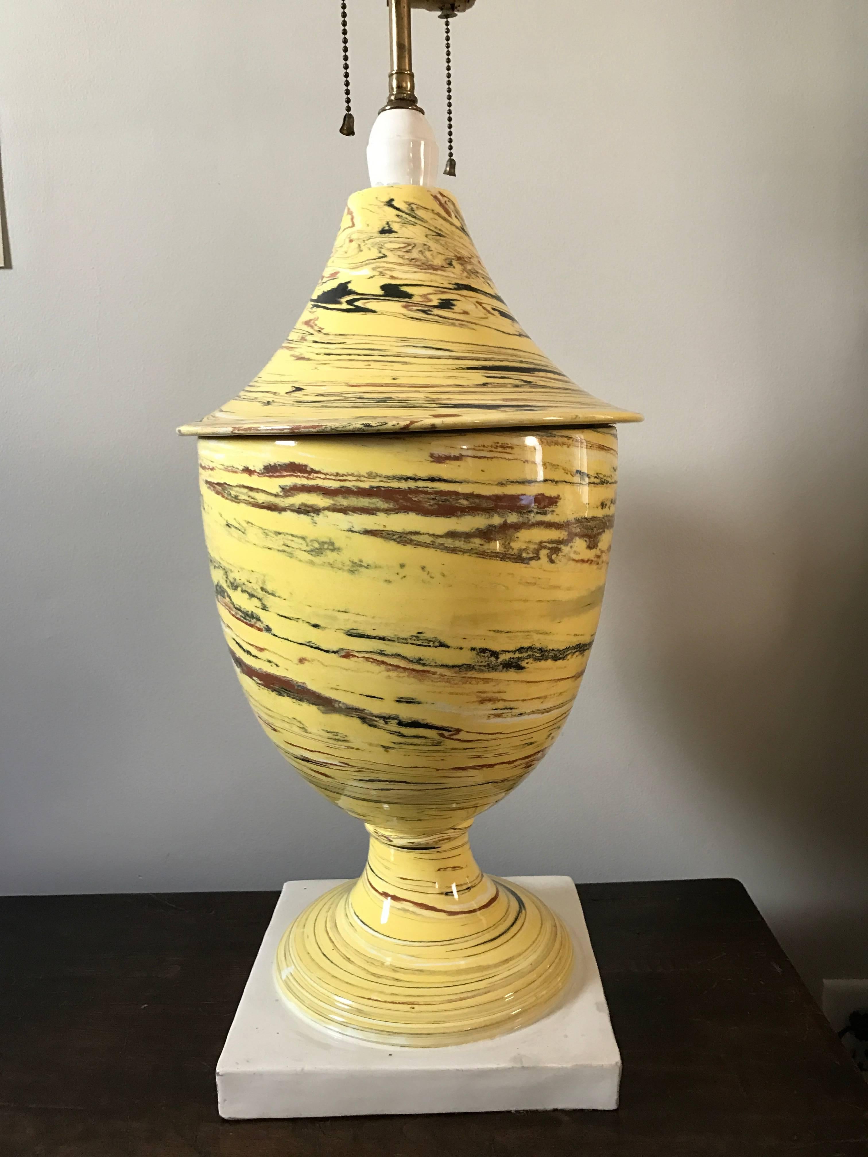 An Italian Mid-Century large-scale neoclassical glazed ceramic lamp. The urn form with yellow black, red and white swirls in an agate ware style, white plinth.