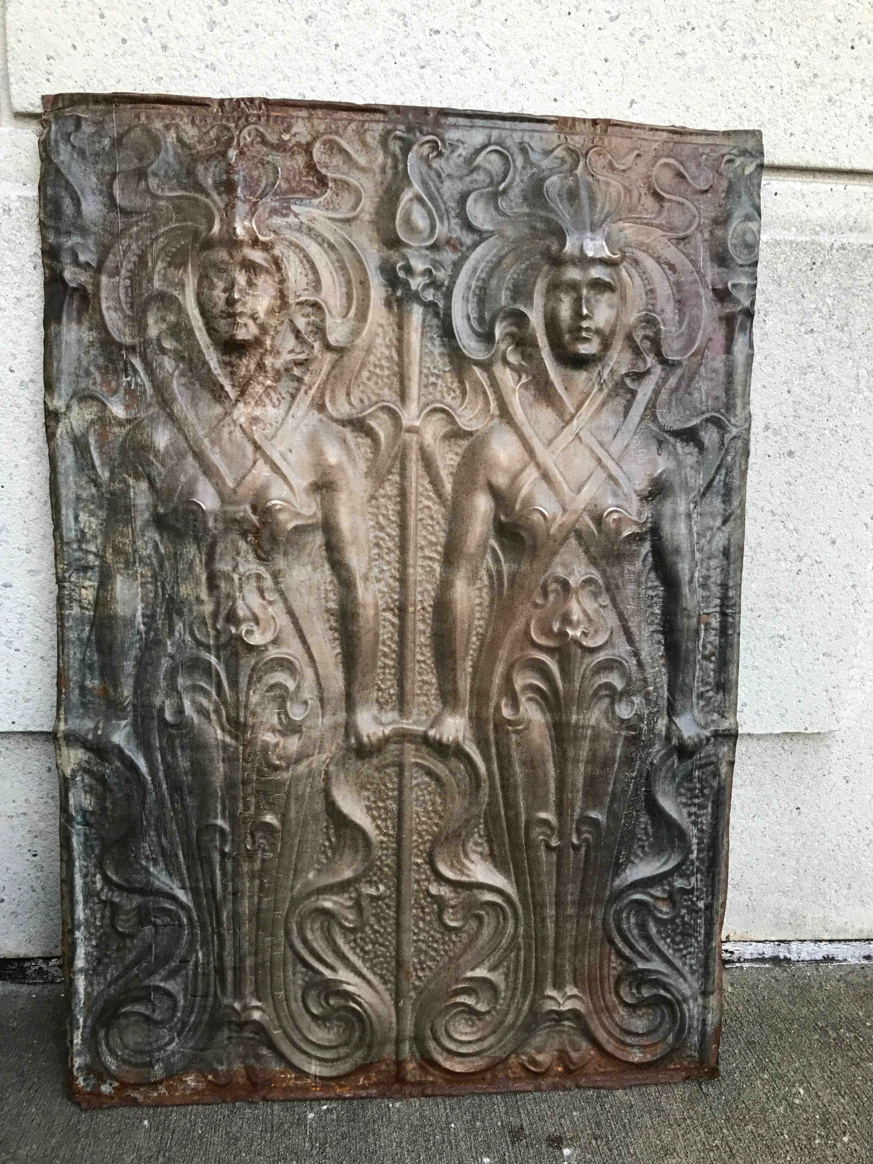 A large scale Austrian zinc wall panel with two female figures in relief. While clearly a wonderful example of Art Nouveau at it's peak these figures look ahead to German Expressionism, bringing to mind the female robot in Fritz Lang's 'Metropolis'.
