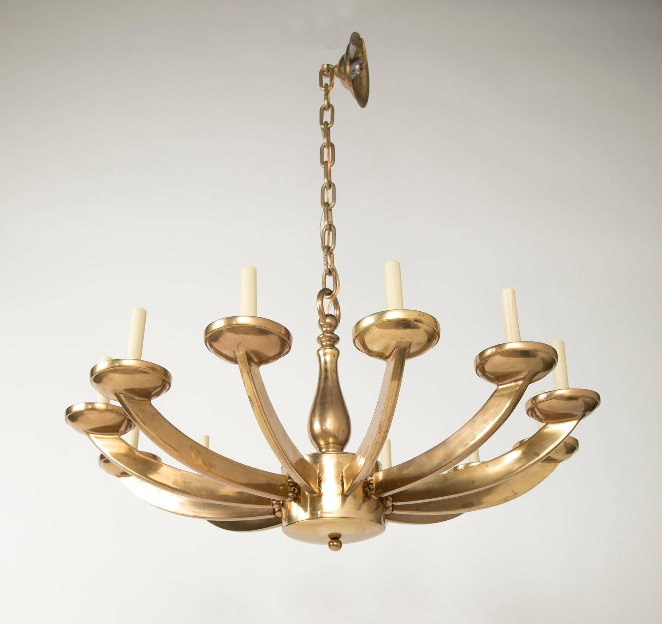 Mid-20th century Italian brass chandelier with twelve arms. 36 inches diameter.