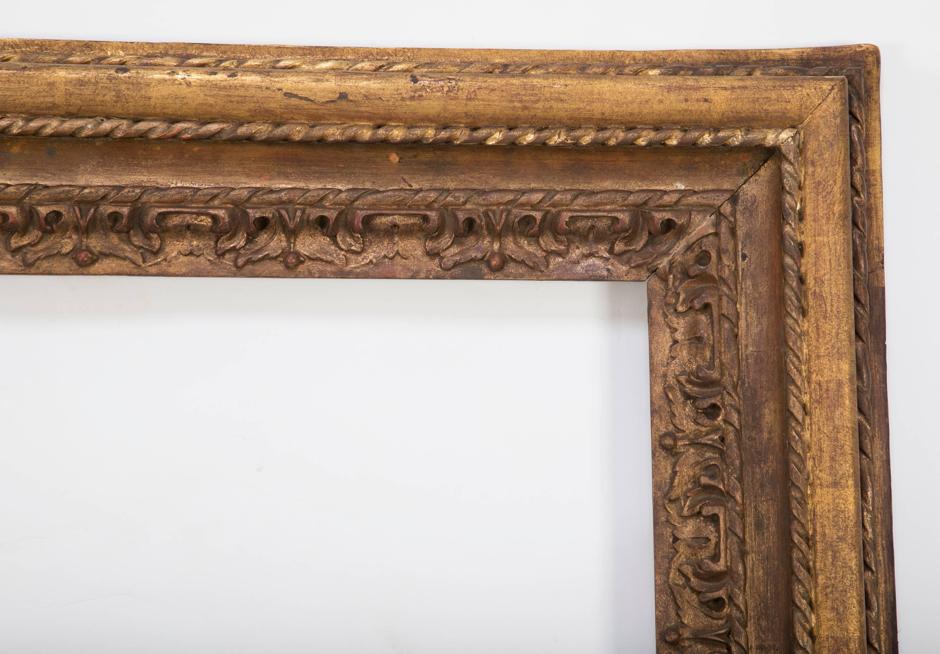 Large-scale Italian Baroque style carved and gilt wood picture frame with the original gilding. With beveled glass. Provenance: Formerly in the collection of the Higgins Armory Museum, MA.

Measure: 50.75 by 47.5 inches.