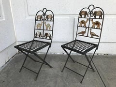 Paire de chaises de jardin en fer forgé avec animaux
