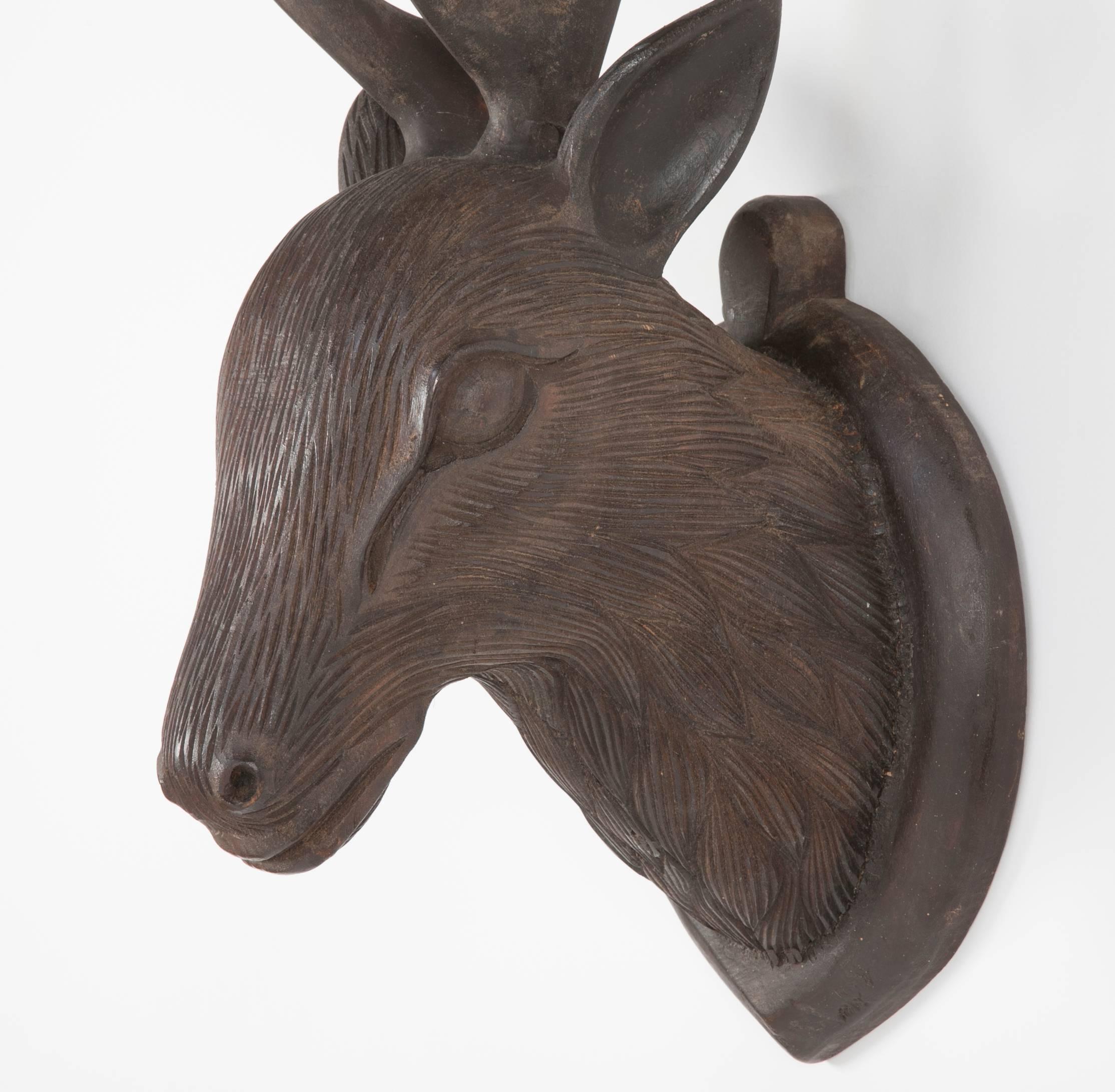 wood carved deer head