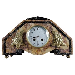 Horloge Art déco en marbre et bronze doré