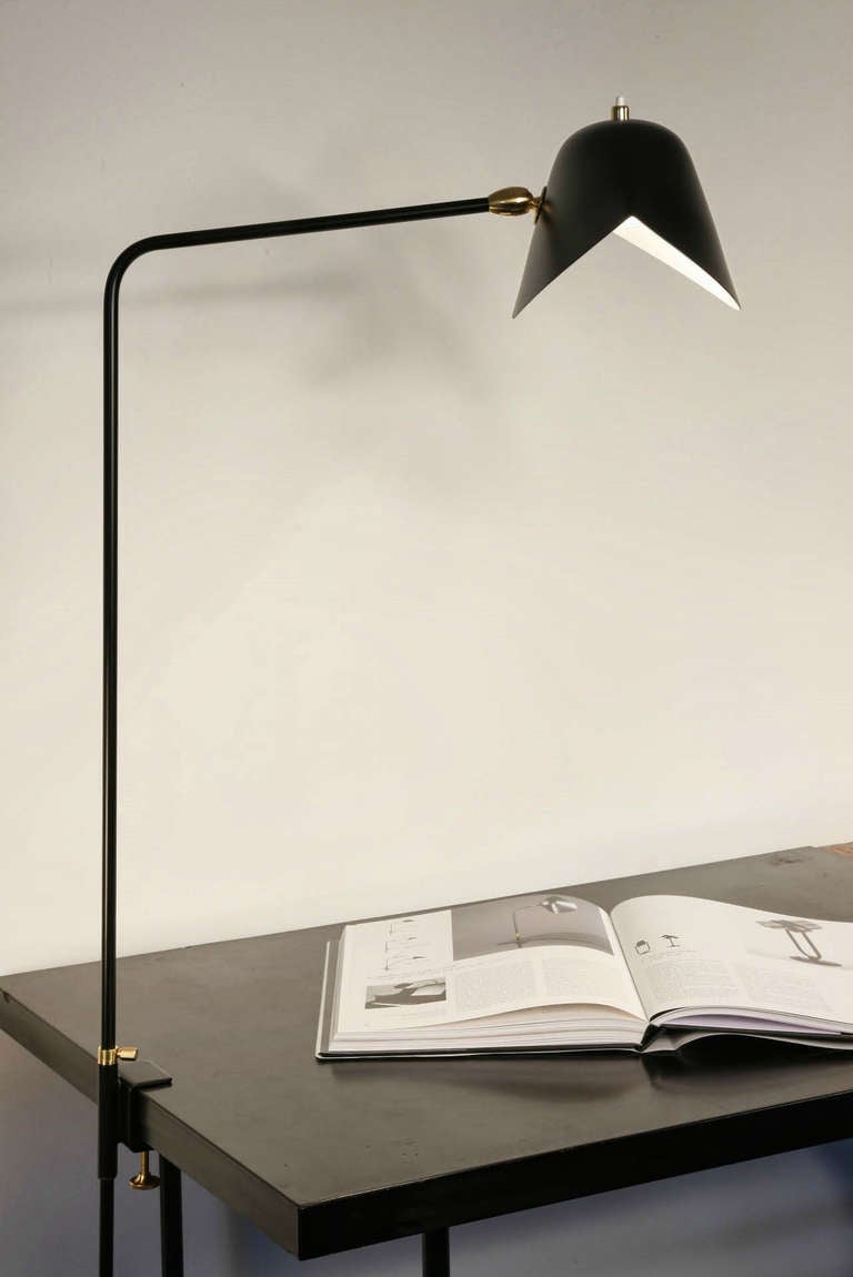 Clamp desk lamp. At 36 inches at its highest, these lamps may affix to many surfaces providing direct lighting where it is needed.

The entire collection of licensed Serge Mouille lighting editions is available in the US exclusively through