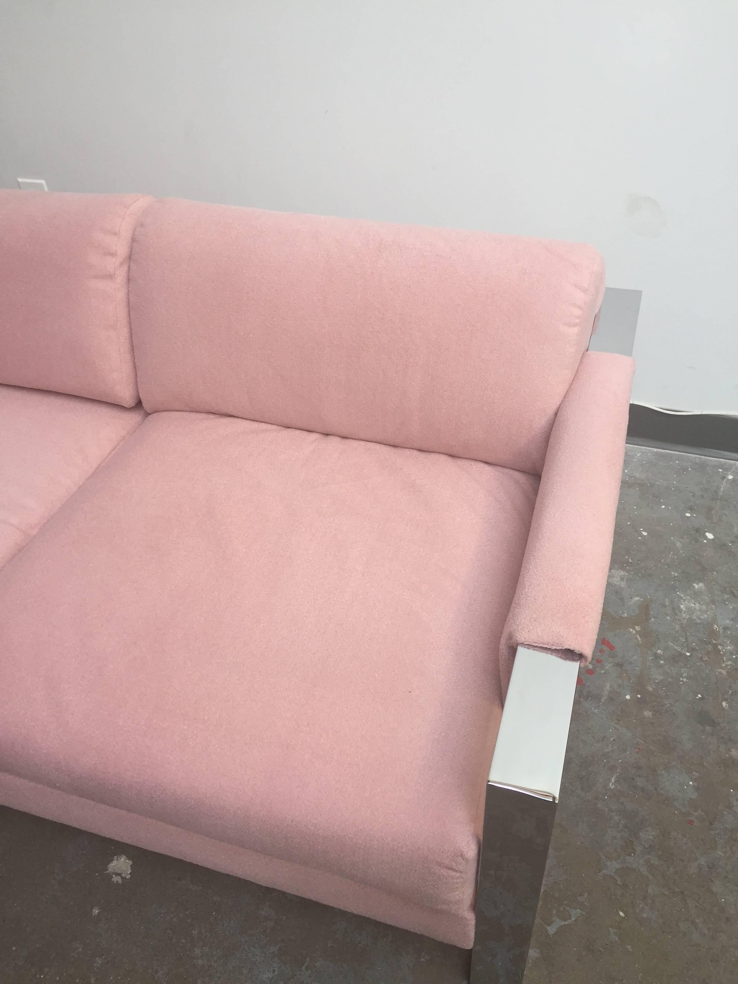 Loveseat with a new light pink fabric. Frame made of chrome and wood.