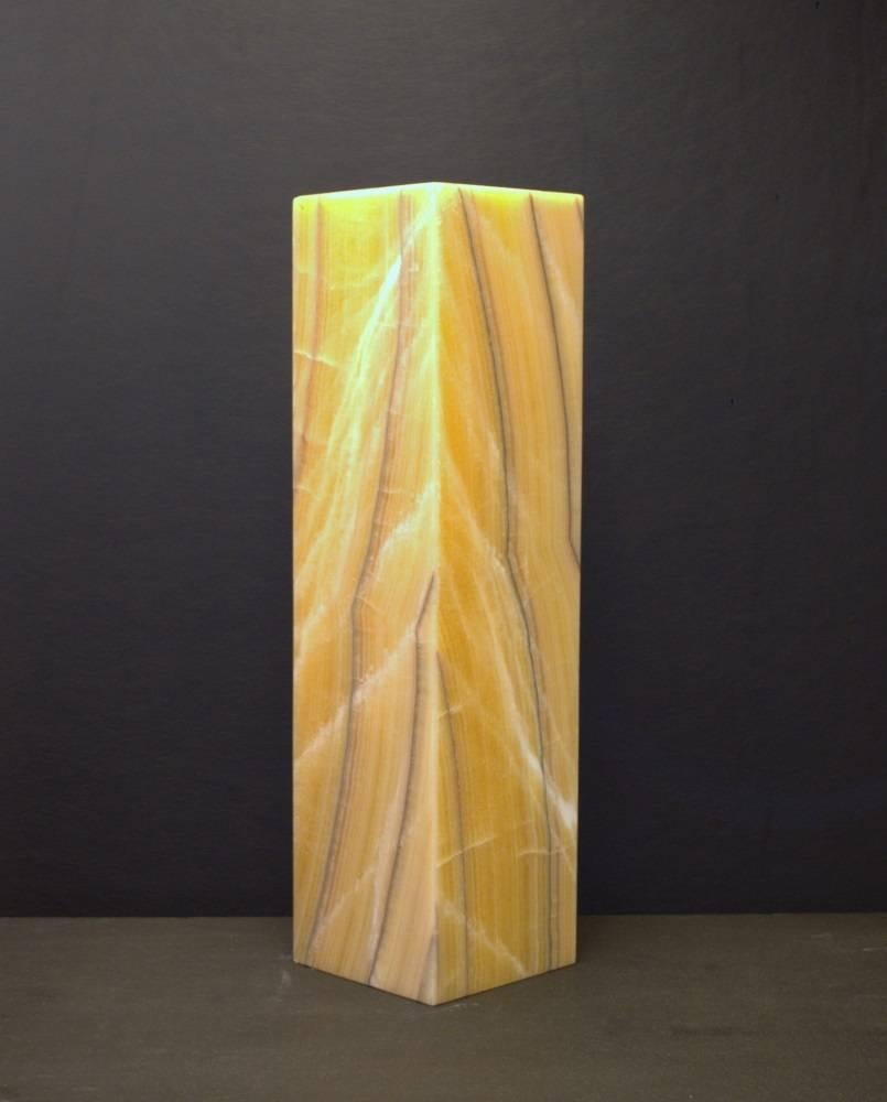 Square based ambient table lamp in onyx.