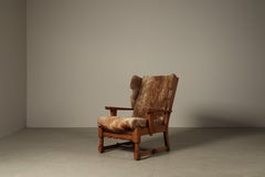 Poltrona e poggiapiedi in rovere in stile brutalista, rivestiti in pelle di capra originale, anni '60