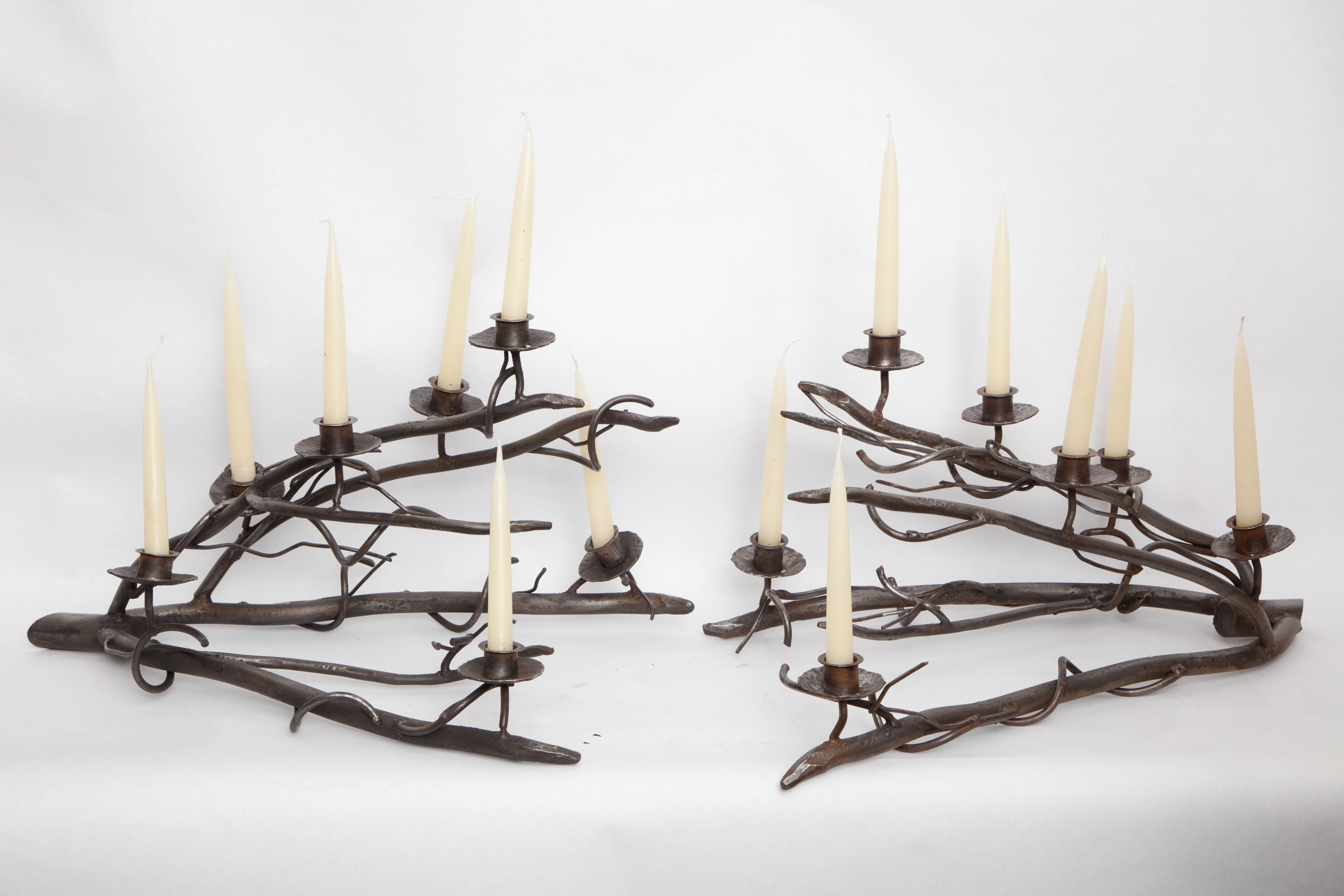 A pair of 1960s hand-wrought iron sculptural candelabras.
