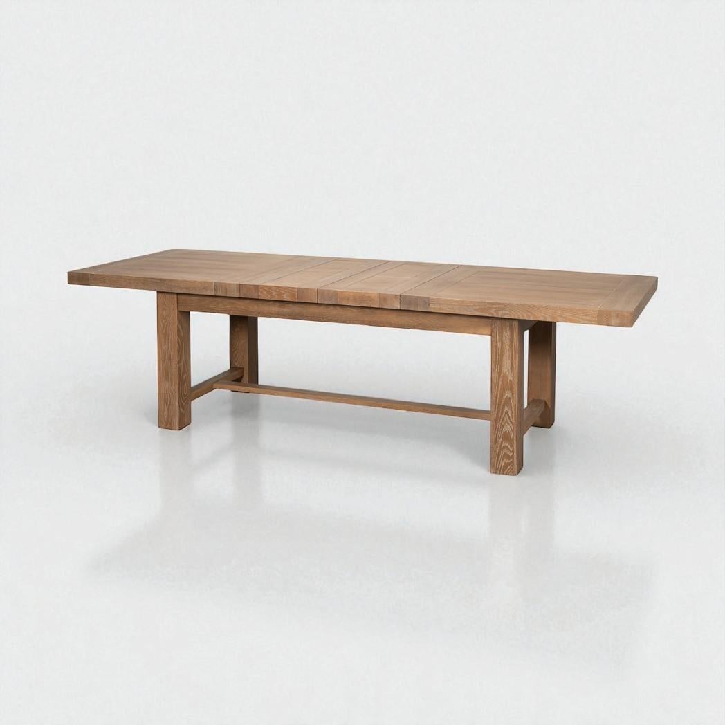 Crafted from natural oak and finished in our signature Dusty Oak tone with a refined cerused texture, the table highlights the natural grain with a softly weathered character that suits both rustic and modern interiors.

The rectangular top extends