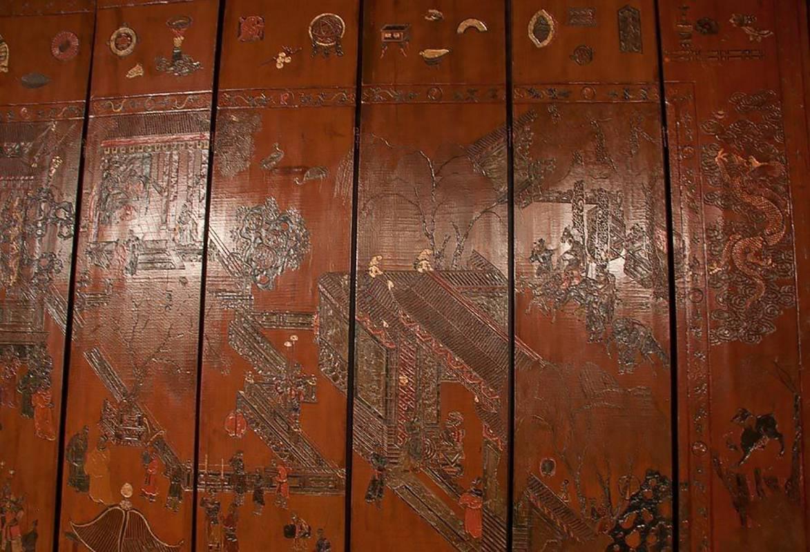 An exceptional and rare 12 panel Chinese carved Coromandel screen. Extensively carved scenes on one side and extensive scrolling text on the other side,

Late 17th-early 18th century. Retaining original pins.
Each panel is 9' High and 17.5