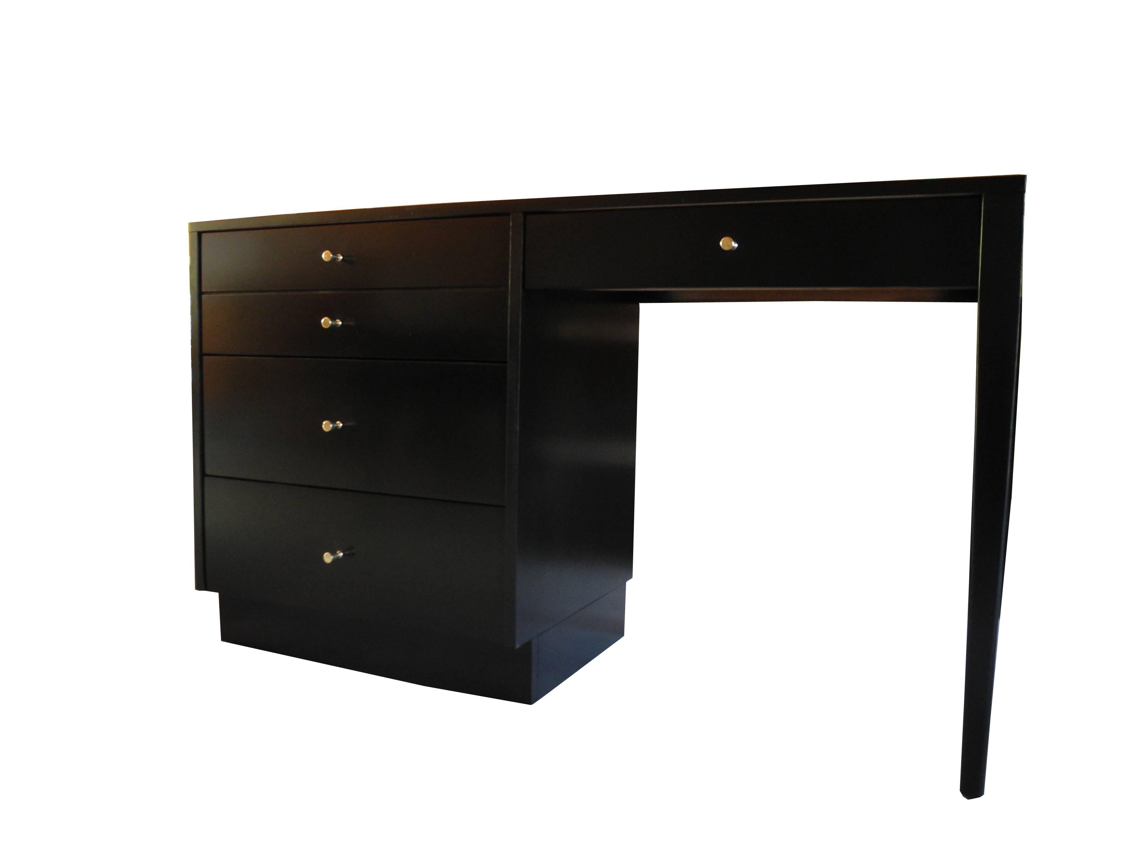 This beautifully proportioned desk was designed by Paul McCobb in the 1950s.
The desk is equipped with a left bank of three drawers with solid brass knobs.
Also sporting a pencil drawer it is a slim 18 inches deep.