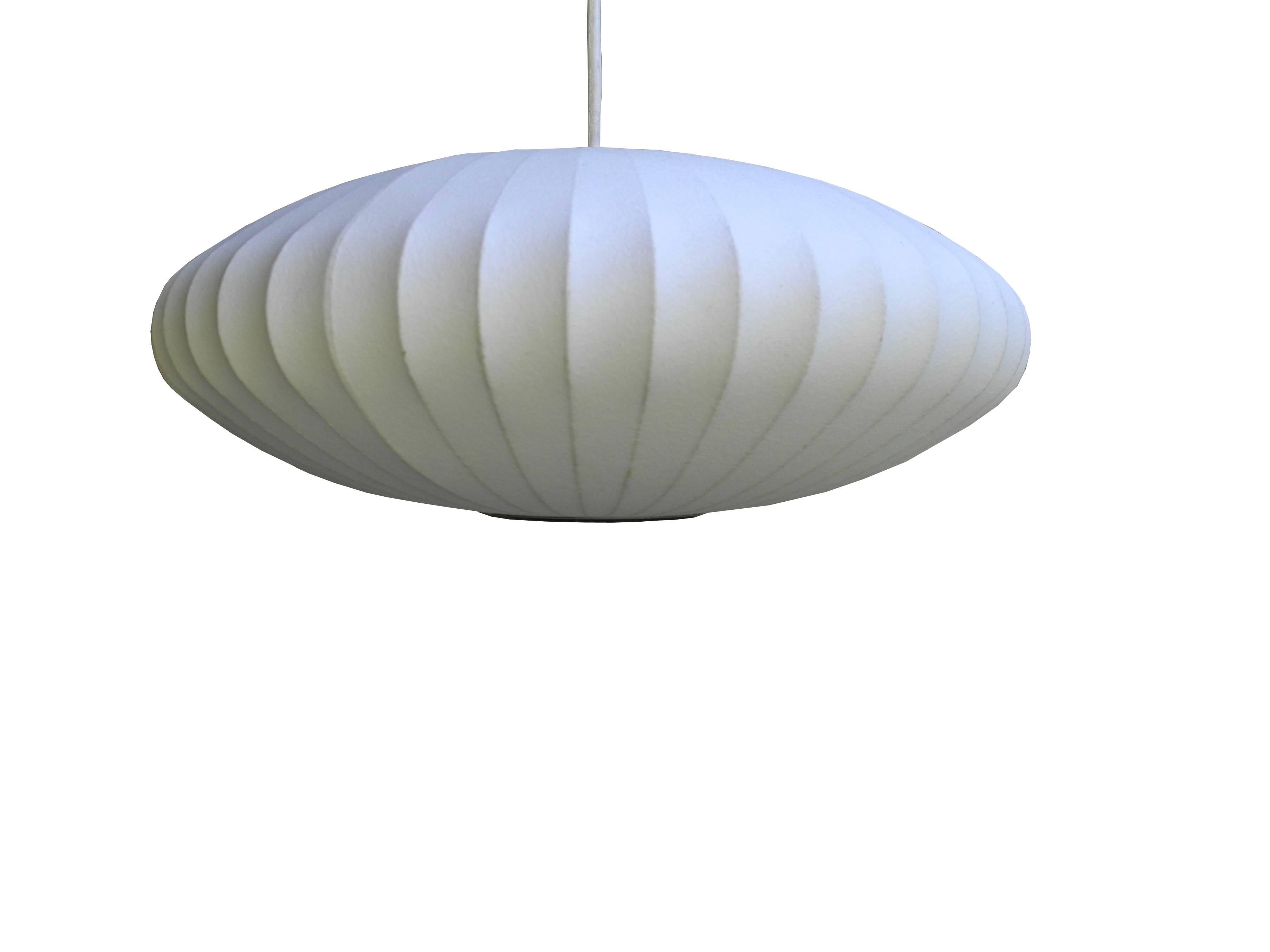 This is a Classic pendant "Bubble Lamp" lamp designed in the 1950s by George Nelson. The color is off-white.
 