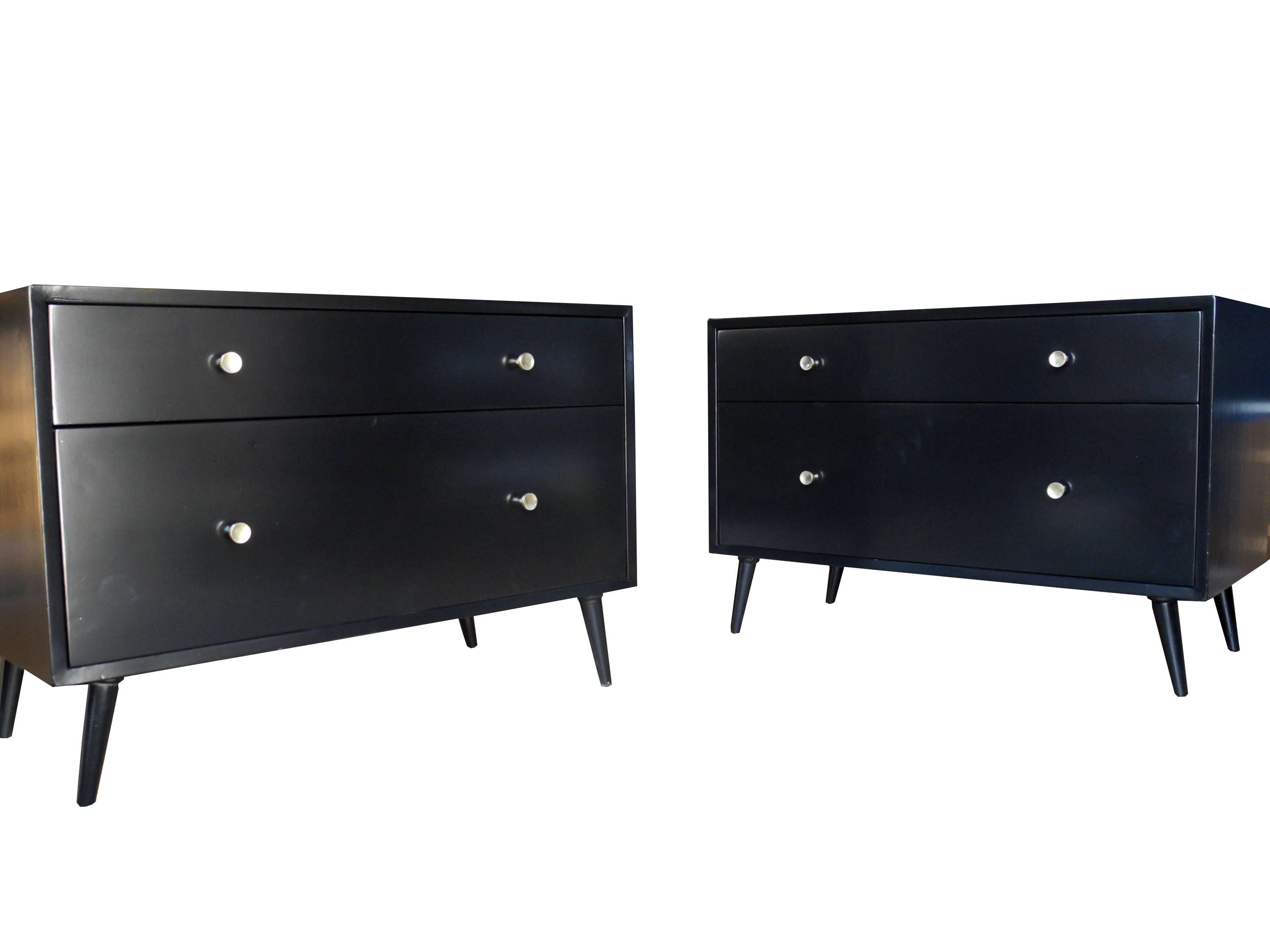 These vintage nightstands or small dressers were designed by Morris Sanders for Mengel Module. Made of painted black mahogany with oak interiors. Equipped with one deep drawer and one shorter drawer. Also available in white but with three drawers.