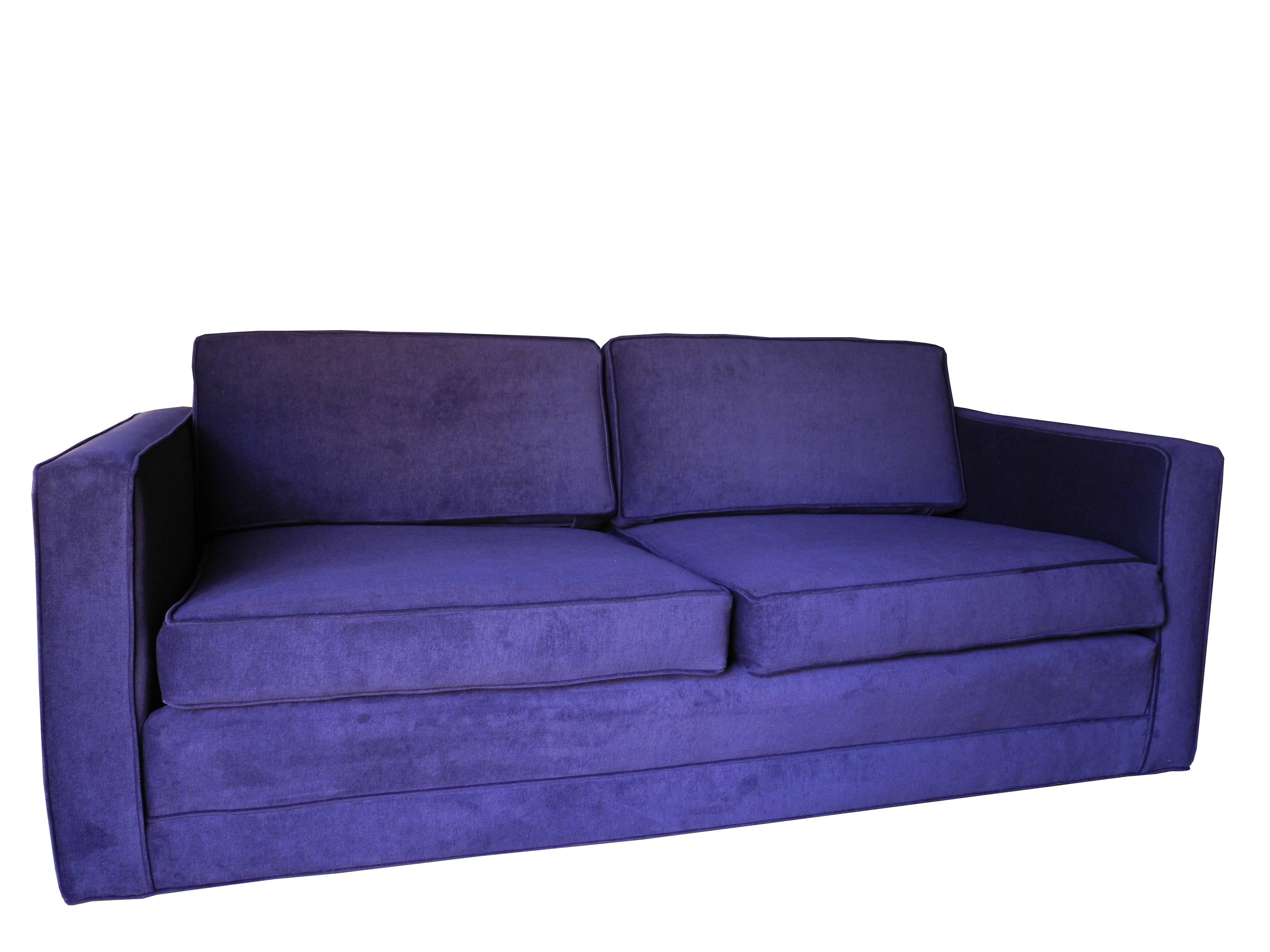 This ultra modern boxy custom settee designed by Charles Pfister for the home or office is upholstered in a deep aubergine / purple cotton velvet. The arm height is 24". Seat height is 16". The top of the back cushion is 28". 68"