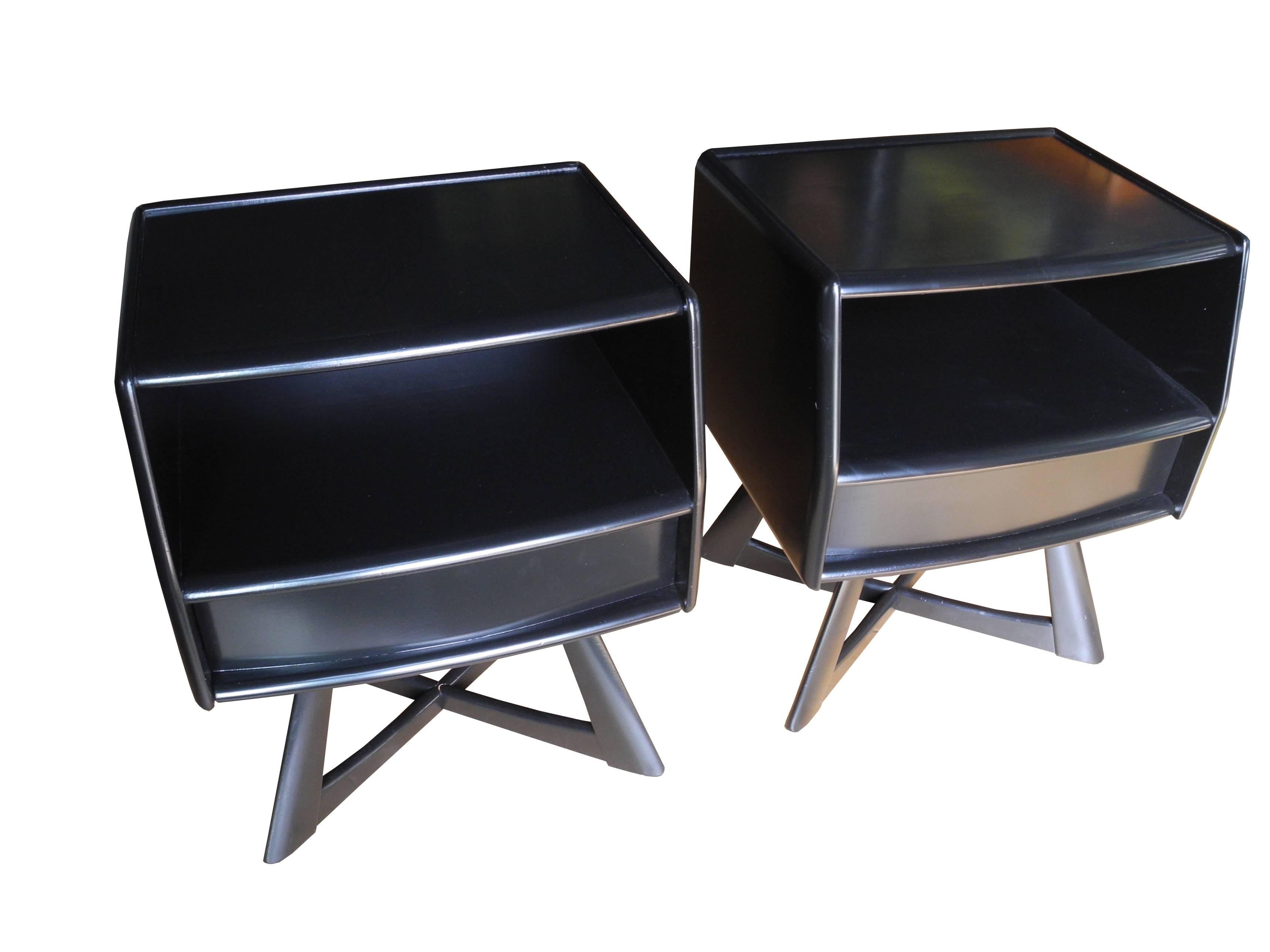 These 1950s bedside tables have a cubby and bottom drawer. They have been newly painted and lacquered in black.