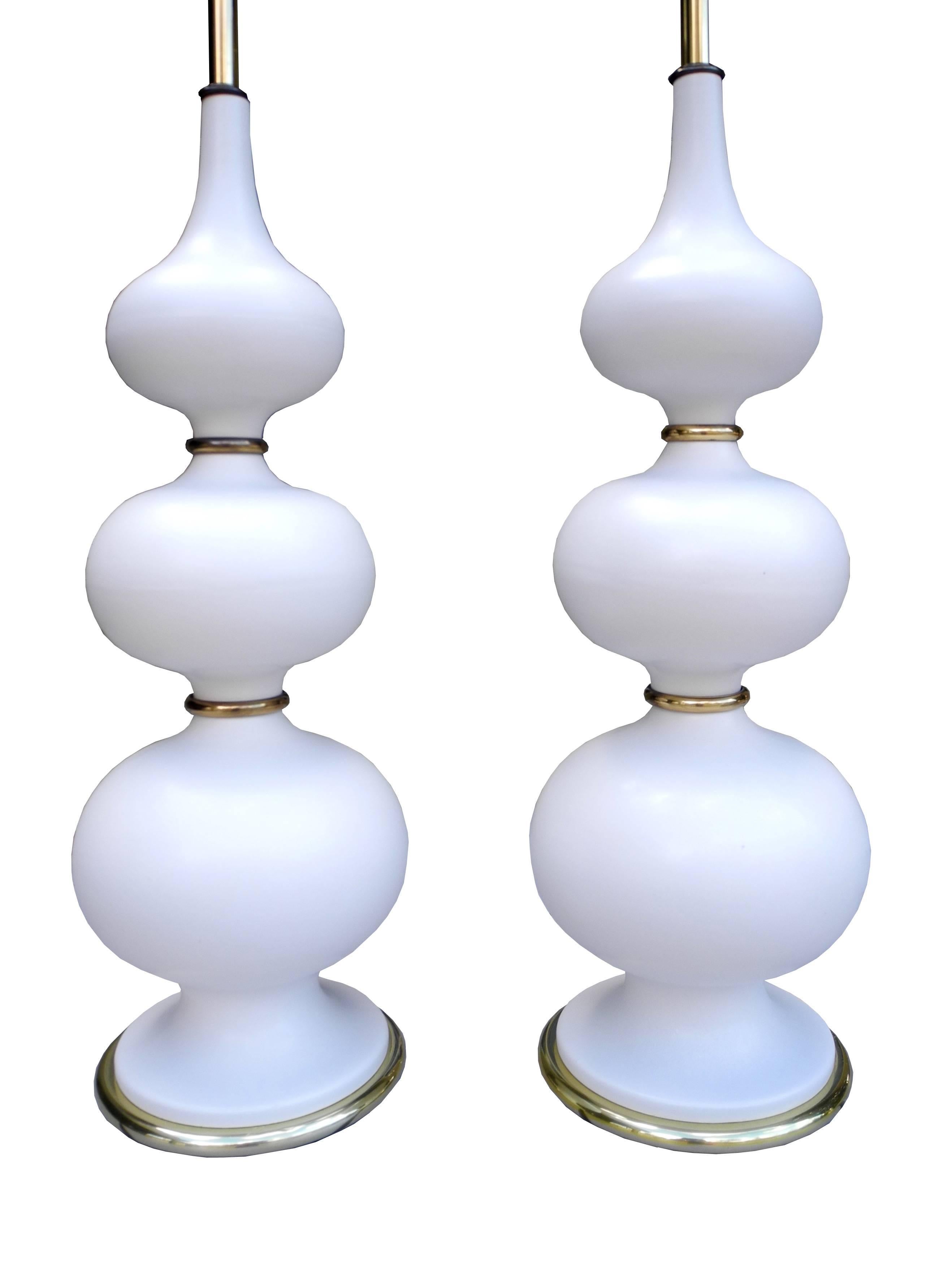 These Thurston ceramics lamps have a strong stance in any room. The top of the sockets measures 26" tall. The top of the finial measures 39". The top of the ceramic is 21". They are in great original condition.