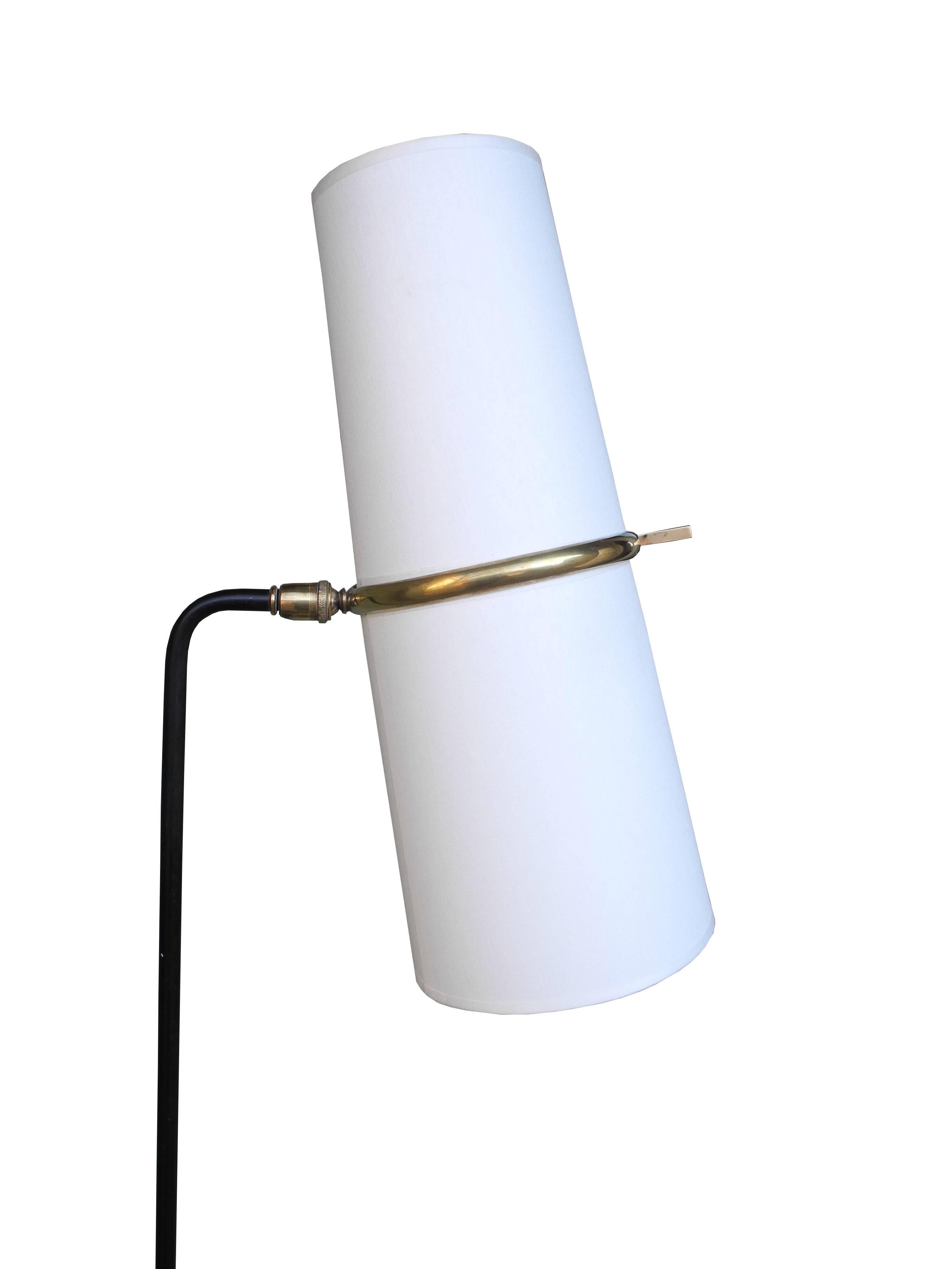 This beautifully crafted floor lamp is from 1950s, France. Made of forged steel and brass with linen shades. Made by Maison Lunel.
 