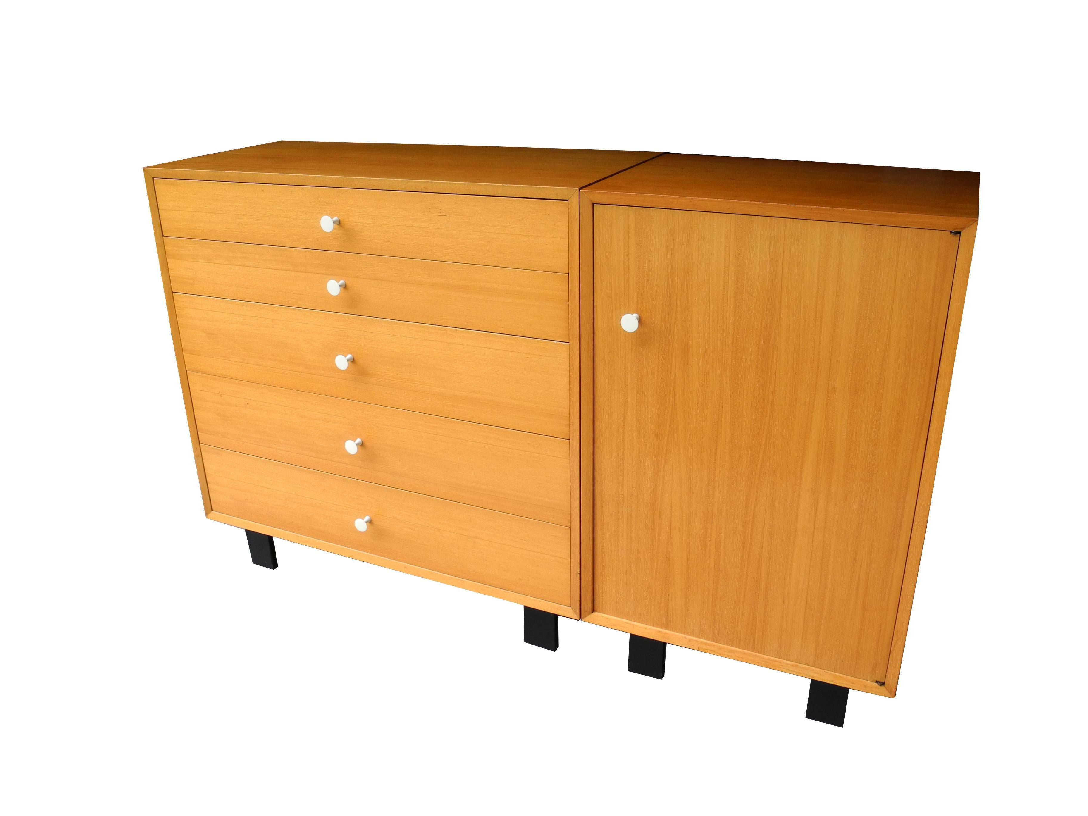 This five-drawer dresser stands next to a single cabinet with a shelf and hanging retractable rod for plenty of storage. Made for the bedroom in an exquisite primavera wood also known as white mahogany. The knobs are painted spun aluminum. The