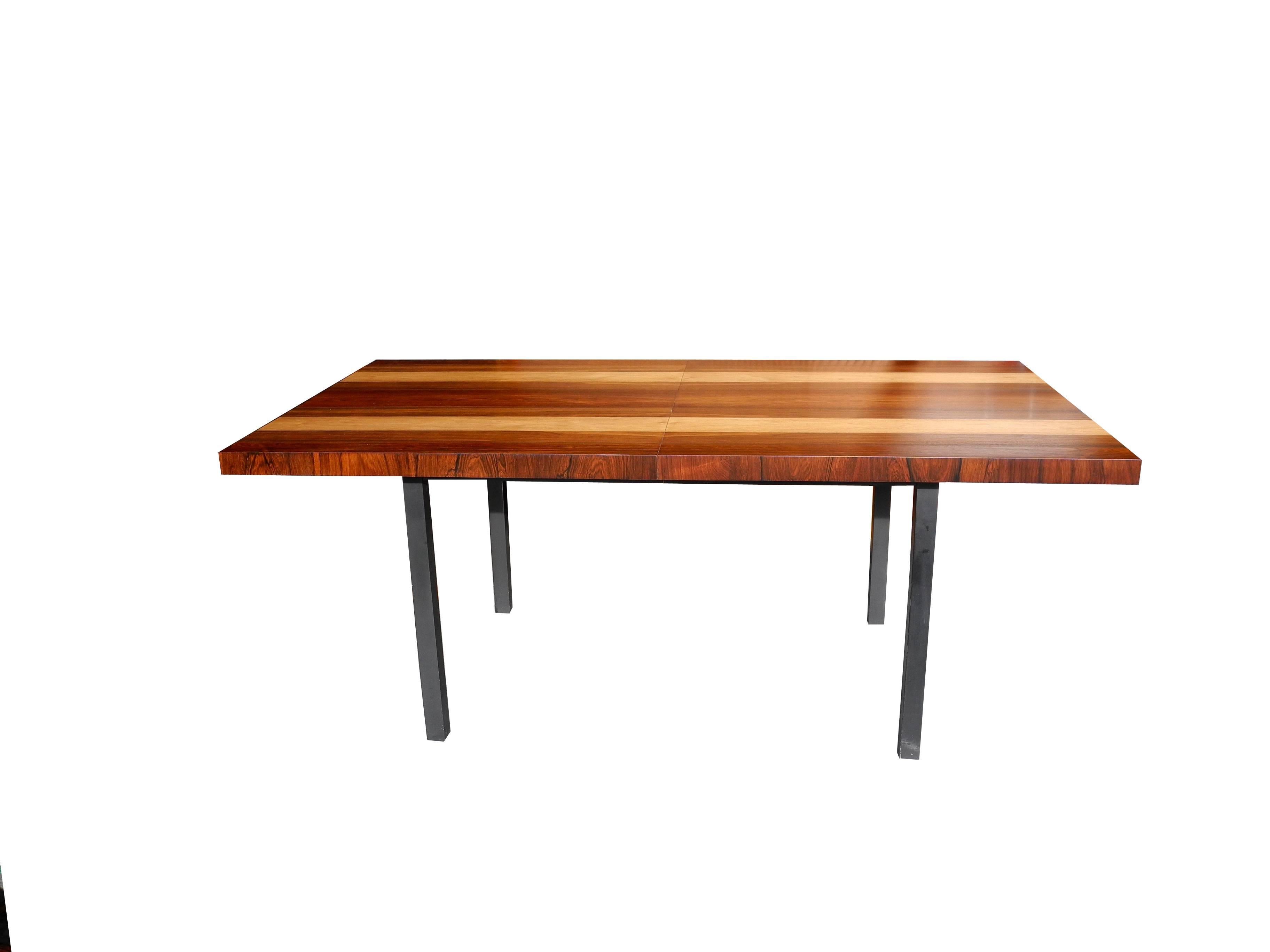 This table is a display of three wood types. Rosewood, walnut and oak. It extends with two additional leaves. All have been refinished to match. It's all about the wood! Dimensions below are without leaves. Each leaf is 39 x 20. You can add an