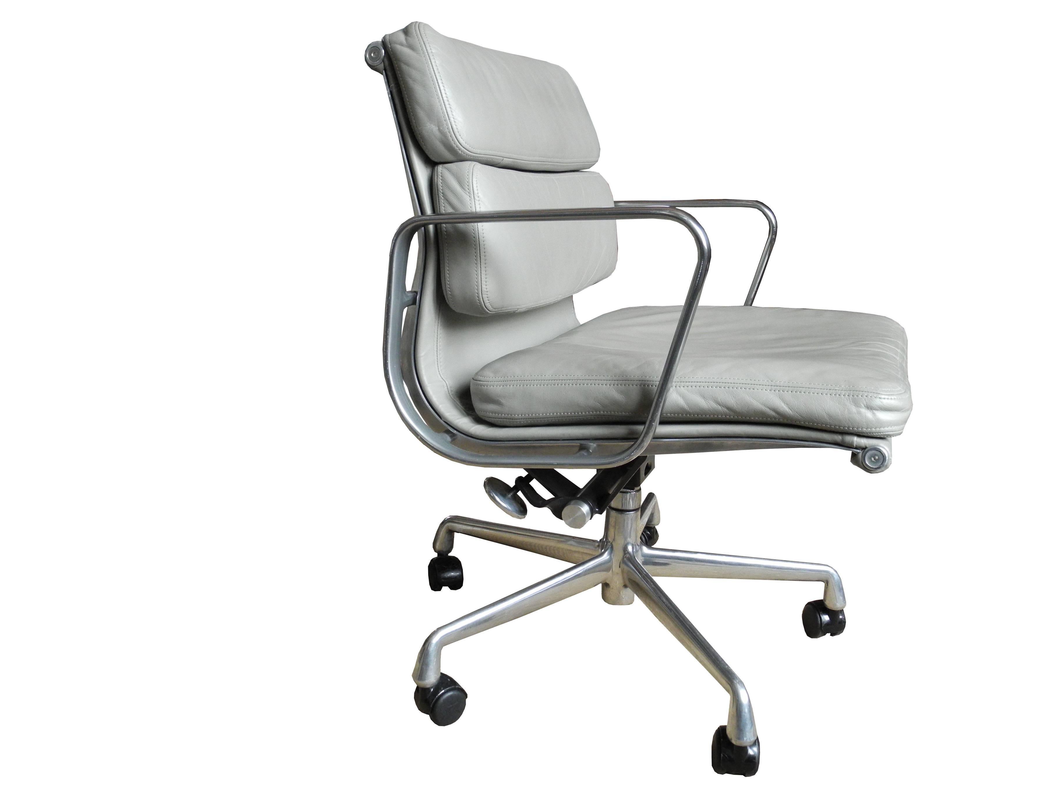 Charles and Ray Eames low back soft pad office or desk chair in light gray leather with adjustable seat.