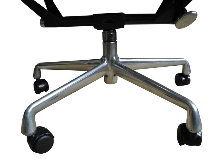 eames soft pad chair in light gray leather on wheels for herman