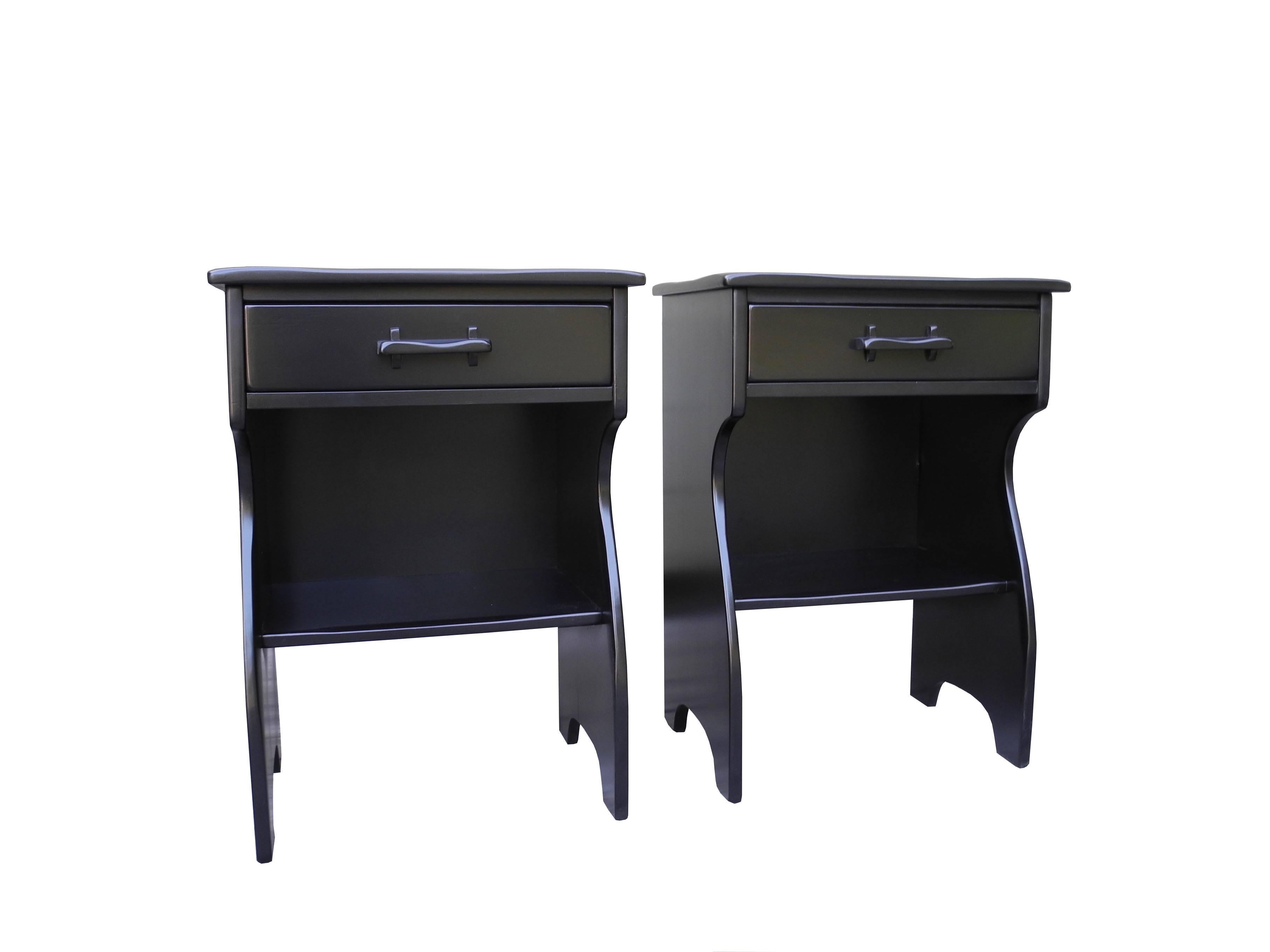 These solid maple nightstands are painted black lacquer are equipped with a cubby shelf and one drawer each.