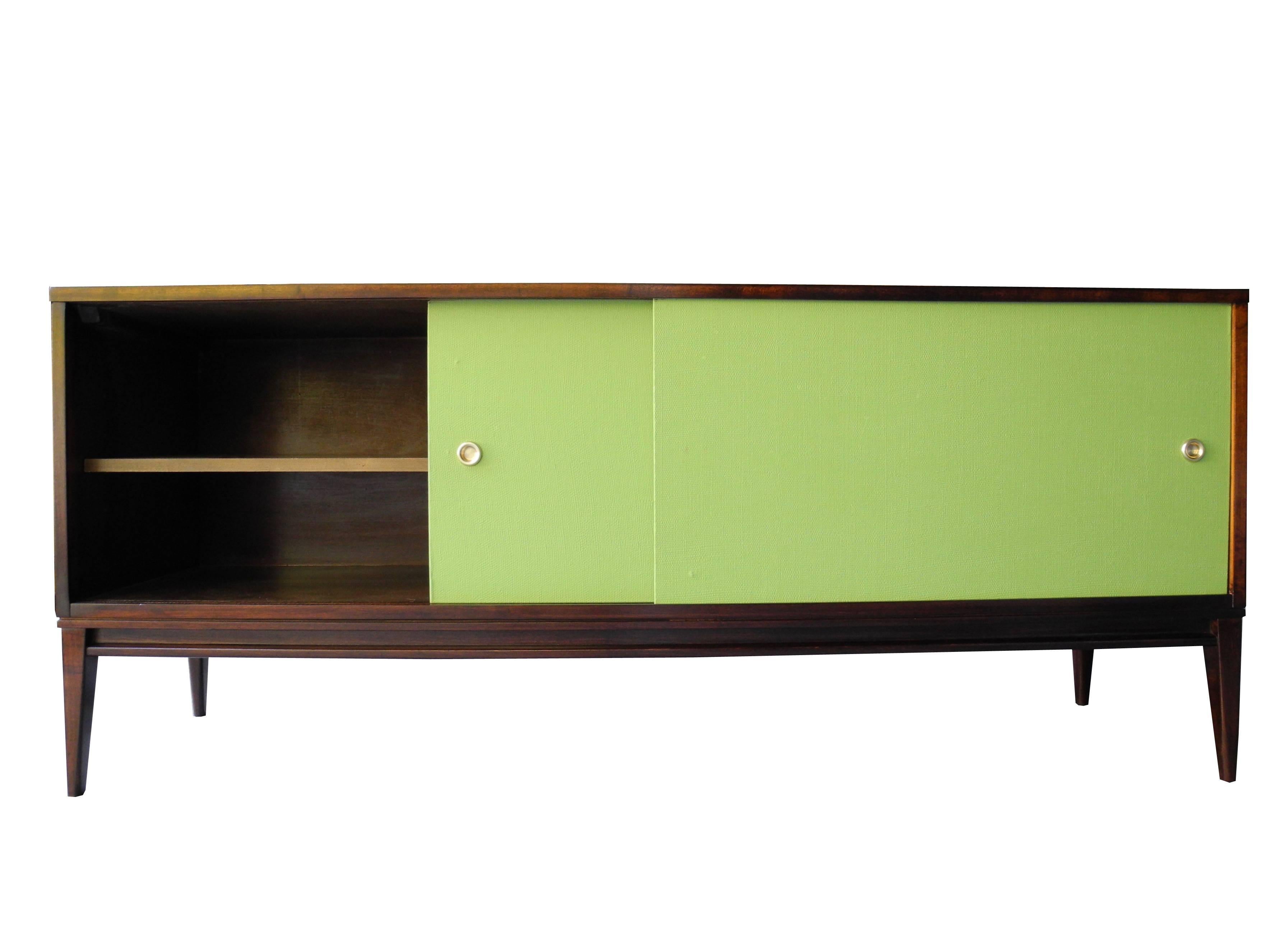 This unique sideboard or credenza comes with two sliding olive green doors and two interior shelves.
It's great for any kind of storage in the home or office.