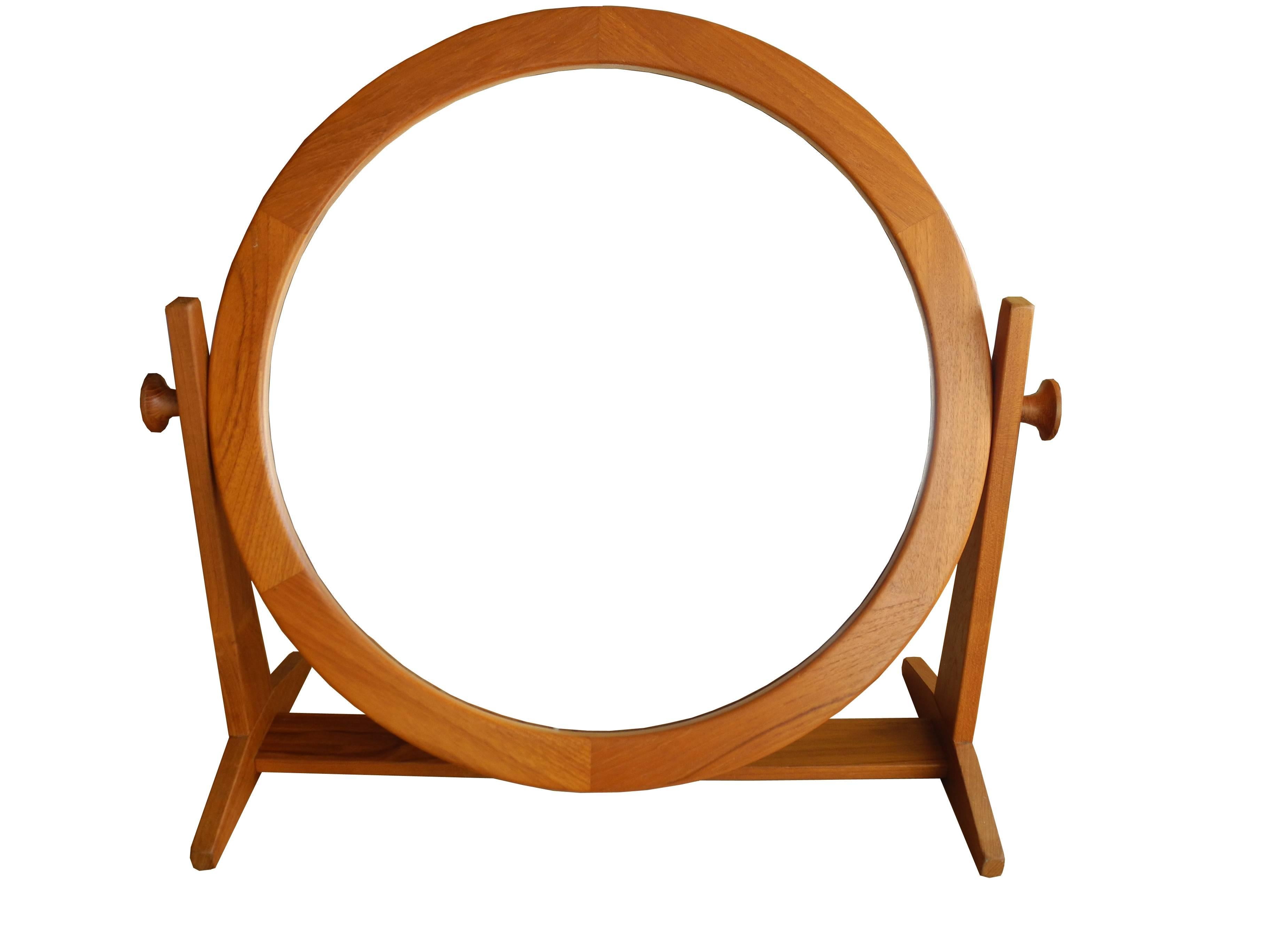 This Danish modern tilting and adjustable mirror was made in Denmark by Pedersen & Hansen in teak.
 