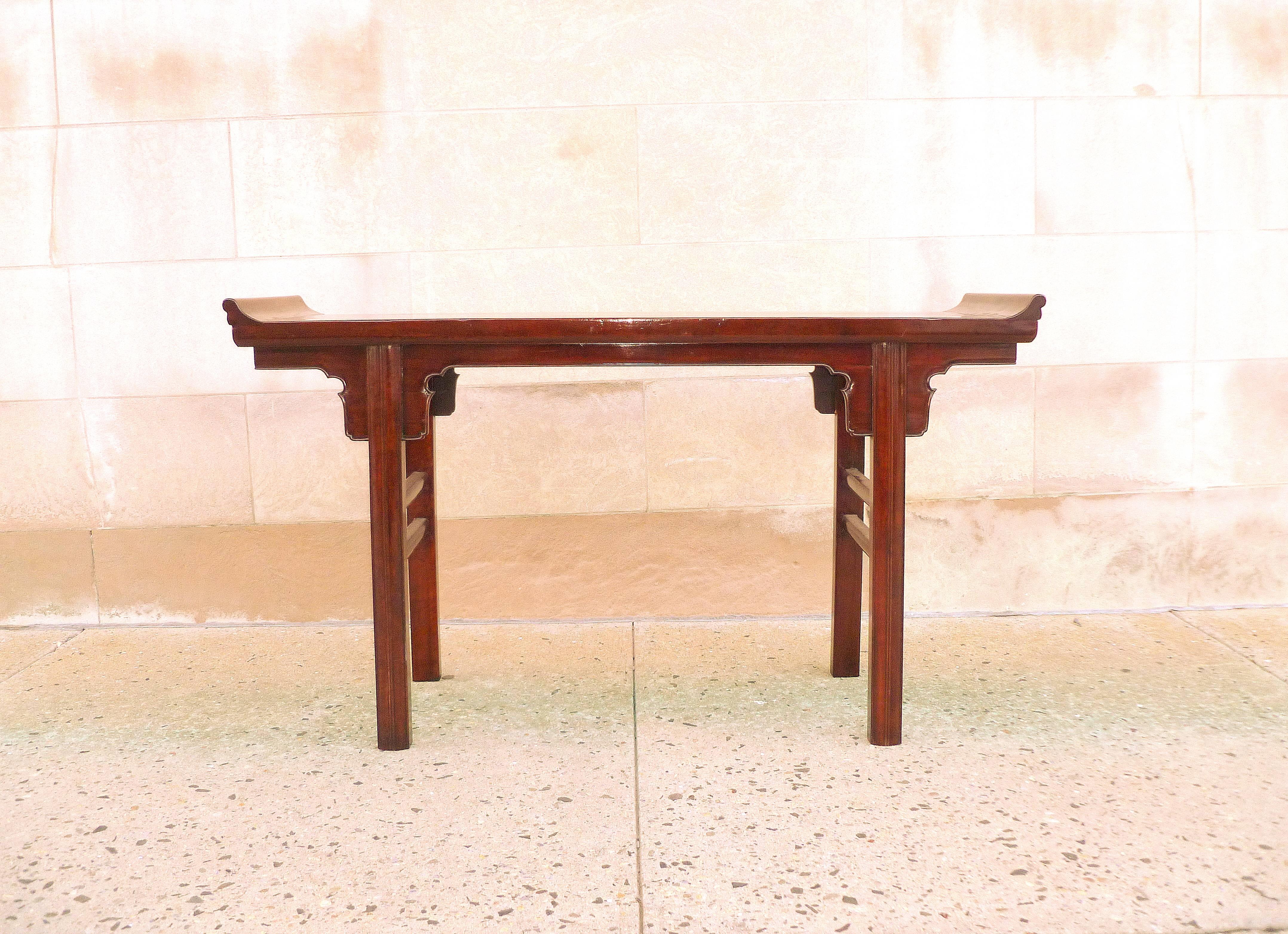 A refined ju mu wood altar table with everted flanges, supported by straight legs, beautiful color, form and lines. We carry fine quality furniture with elegant finished and has been appeared many times in 