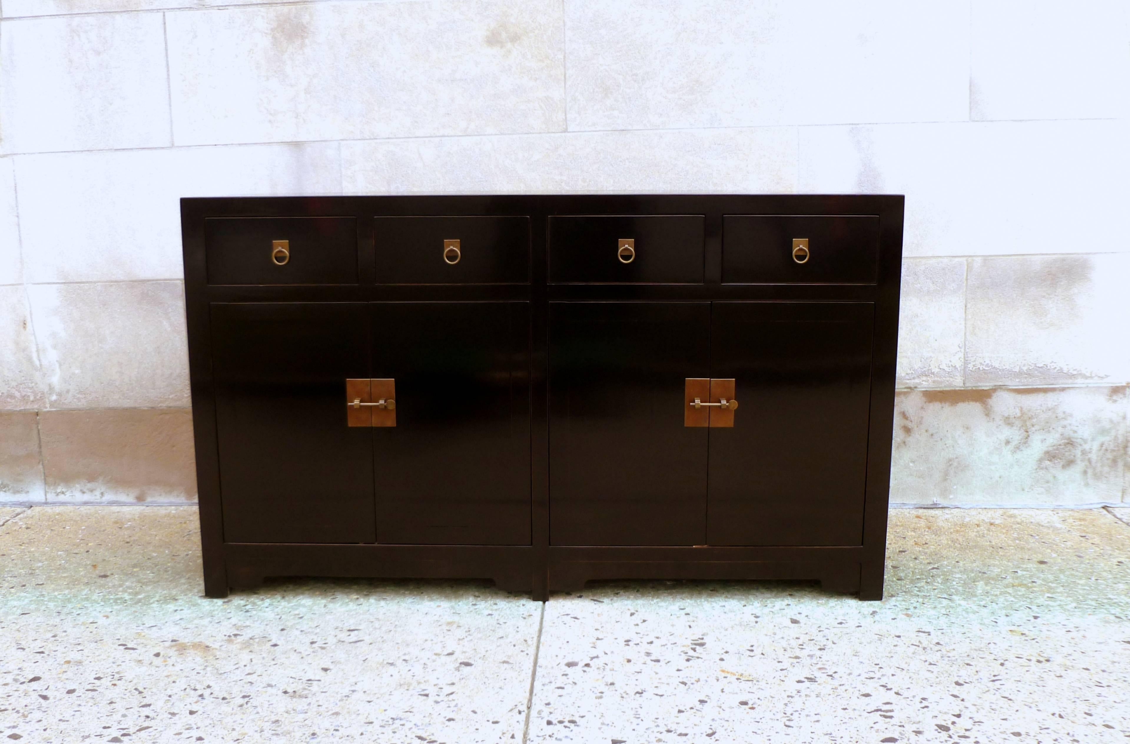 Fine black lacquer sideboard with drawers and doors, brass pulls and shelf inside.