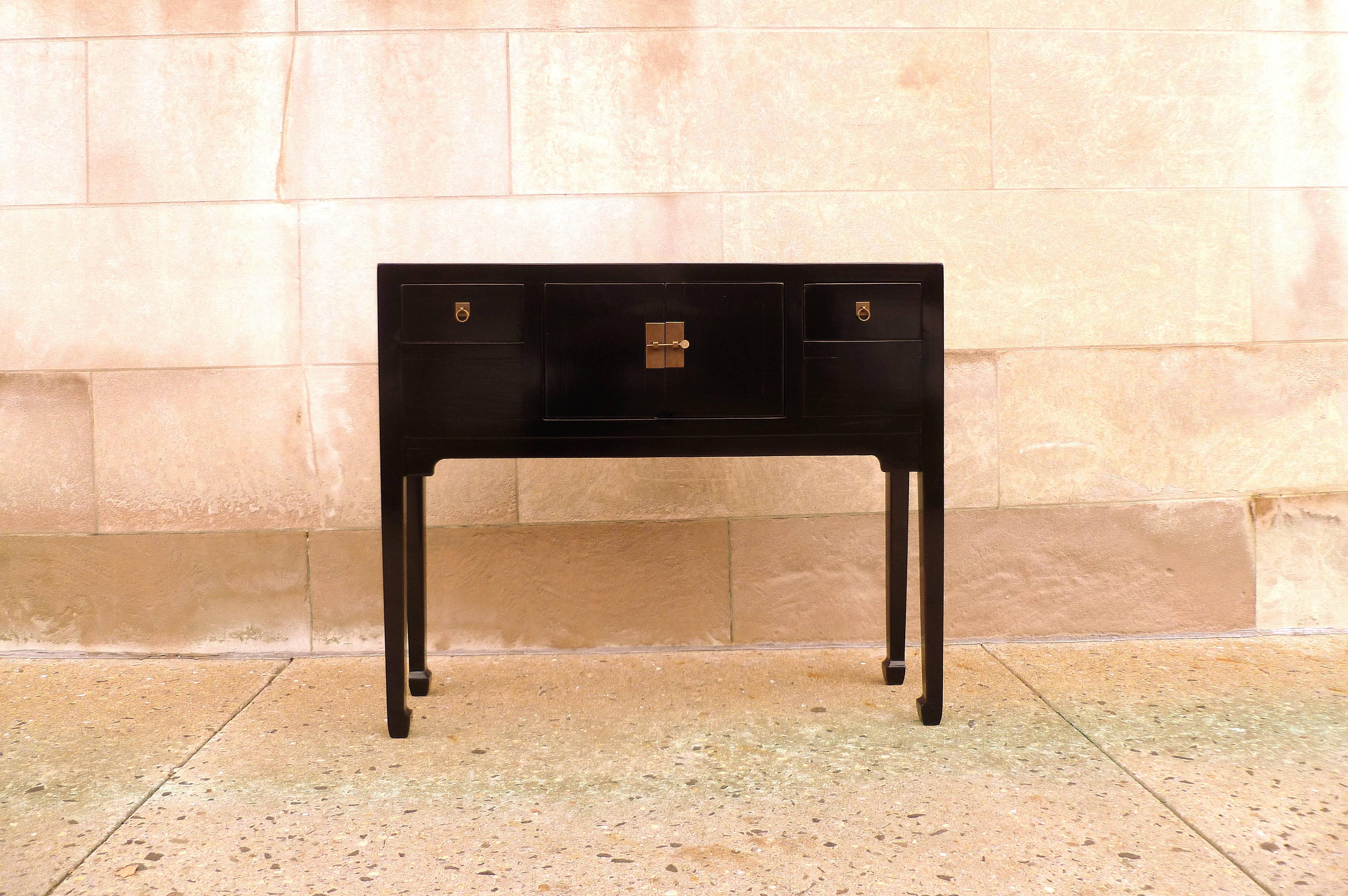 Fine black lacquer console table with two drawers and pair of doors. Simple and very elegant table, beautiful color.