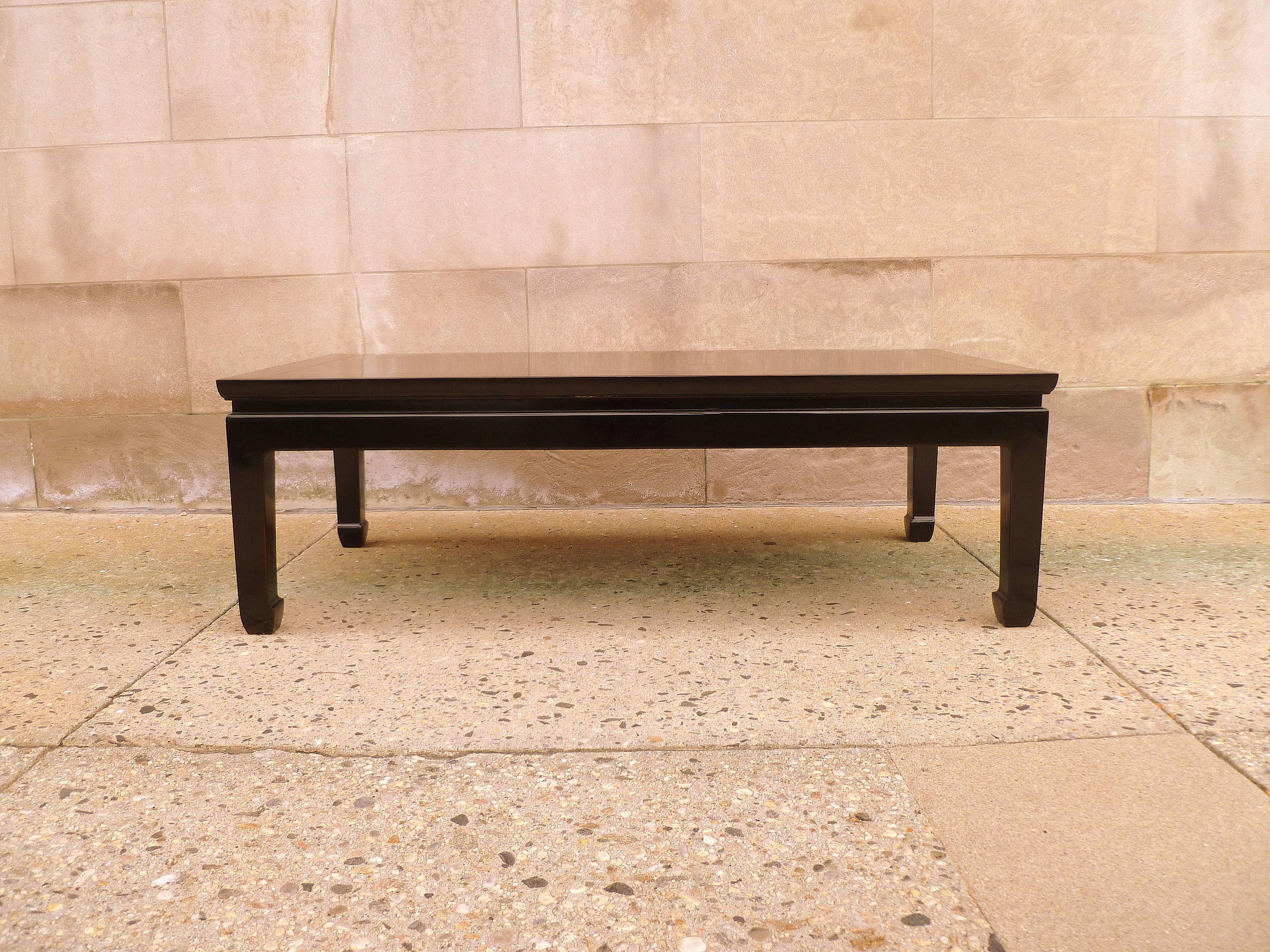 Elegant black lacquer rectangular low table with fine hand-painted landscape motif in gold gilt on top.