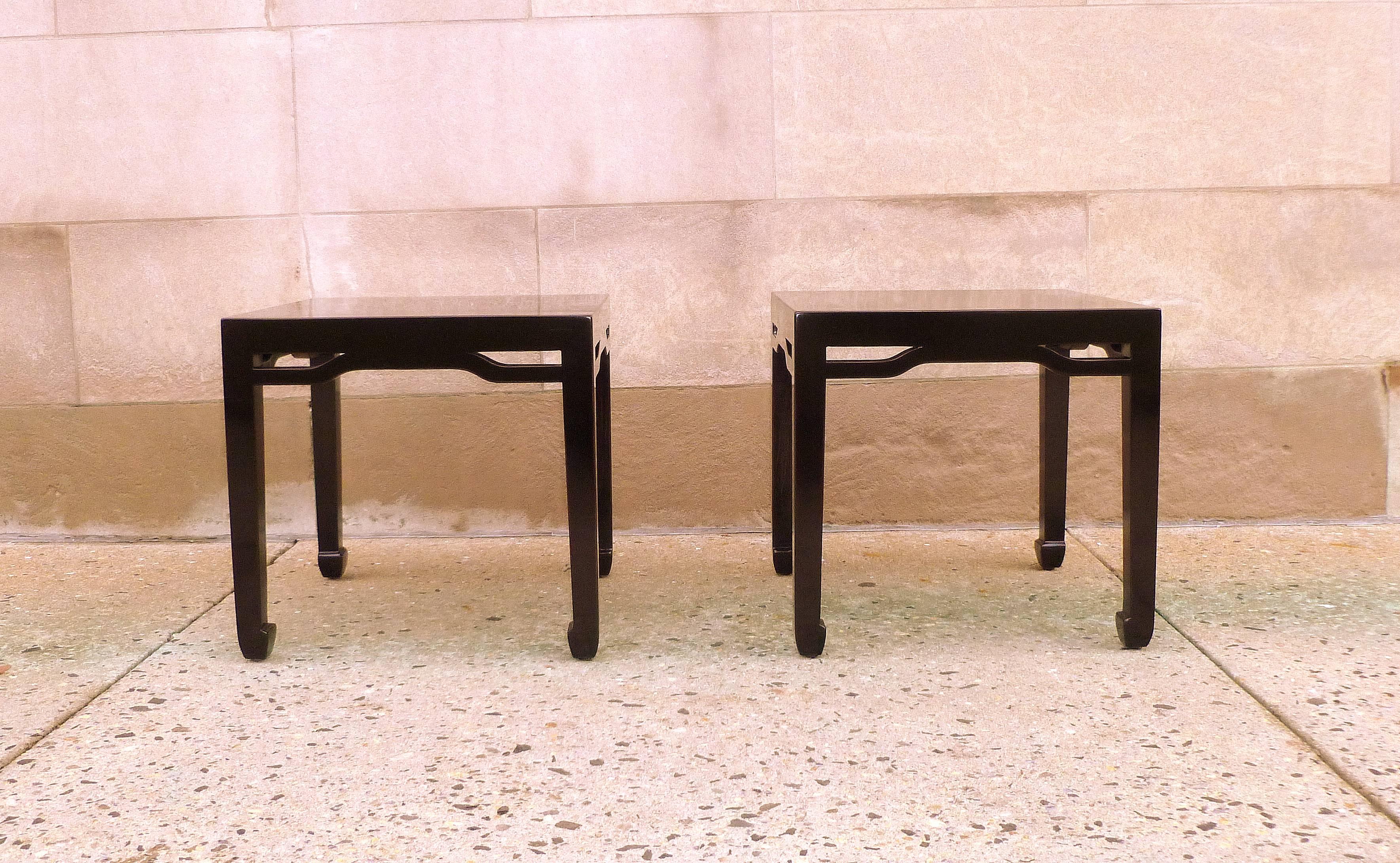 A pair of refined and elegant black lacquer square end tables.  We carry fine quality furniture with elegant finished and has been appeared many times in 