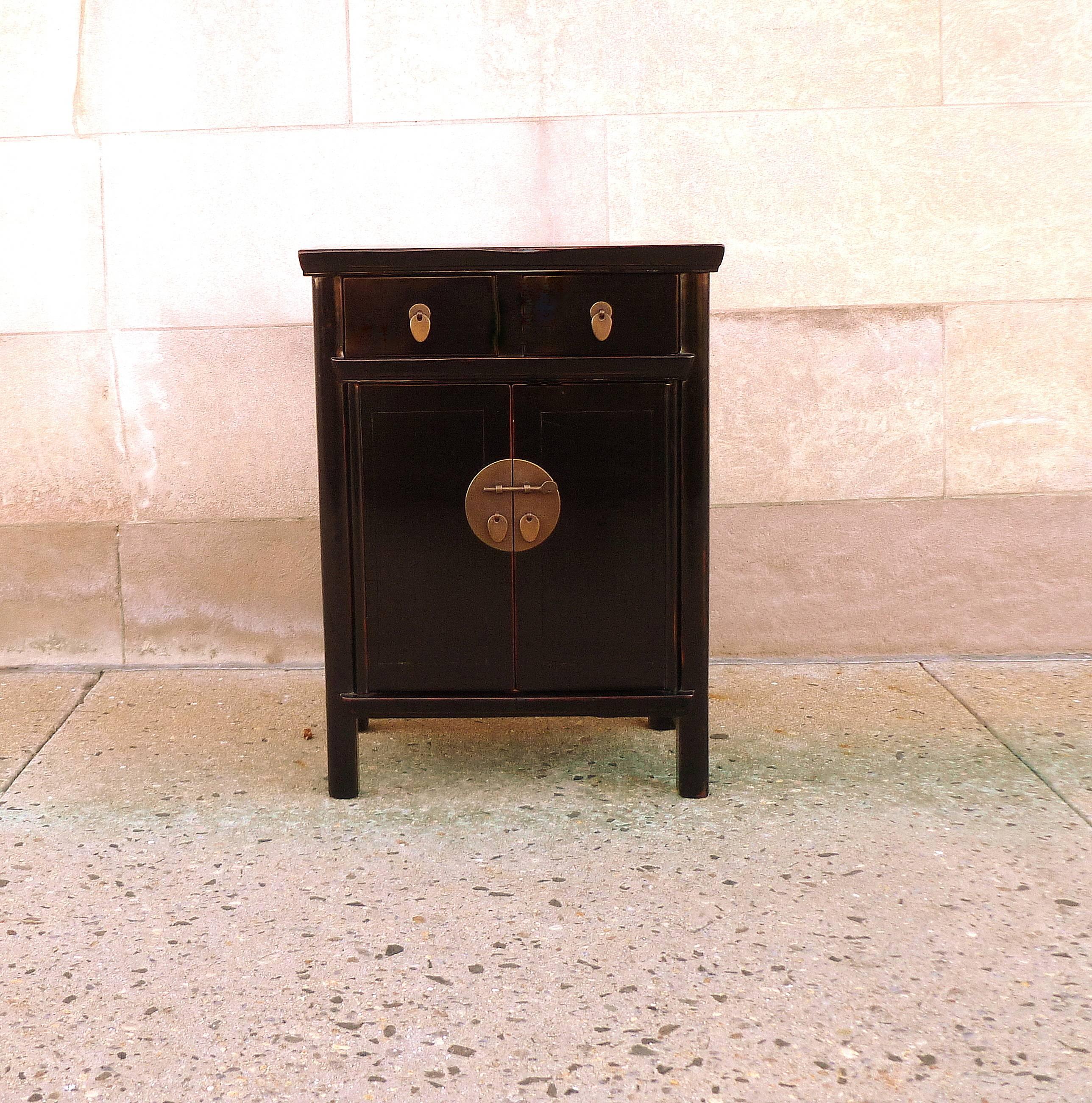Fine black lacquer chest with two drawers and a pair of open doors. Simple and elegant. Beautiful color and form.