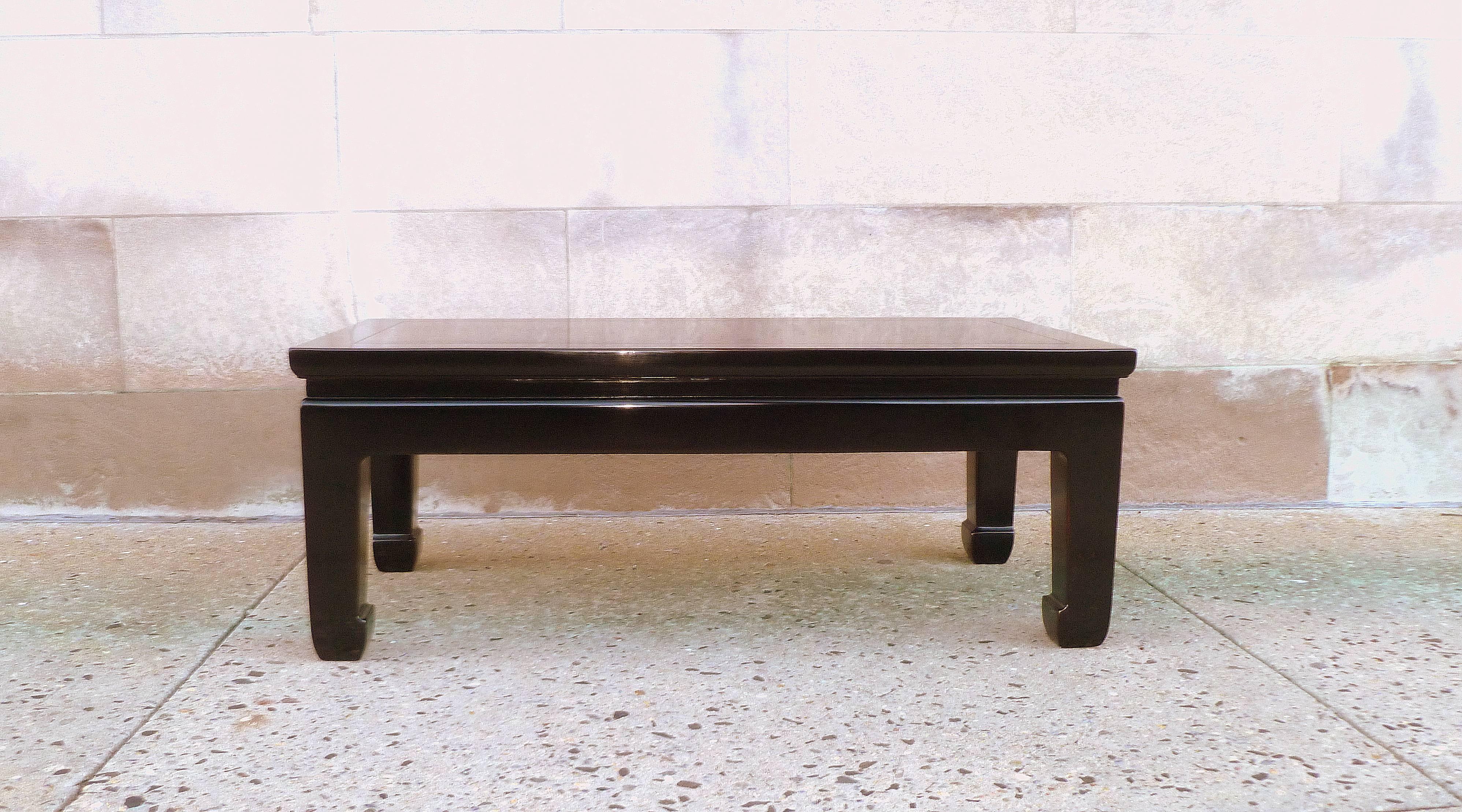 Fine black lacquer low table with gilt floral motif. Elegant and simple form, beautiful color.