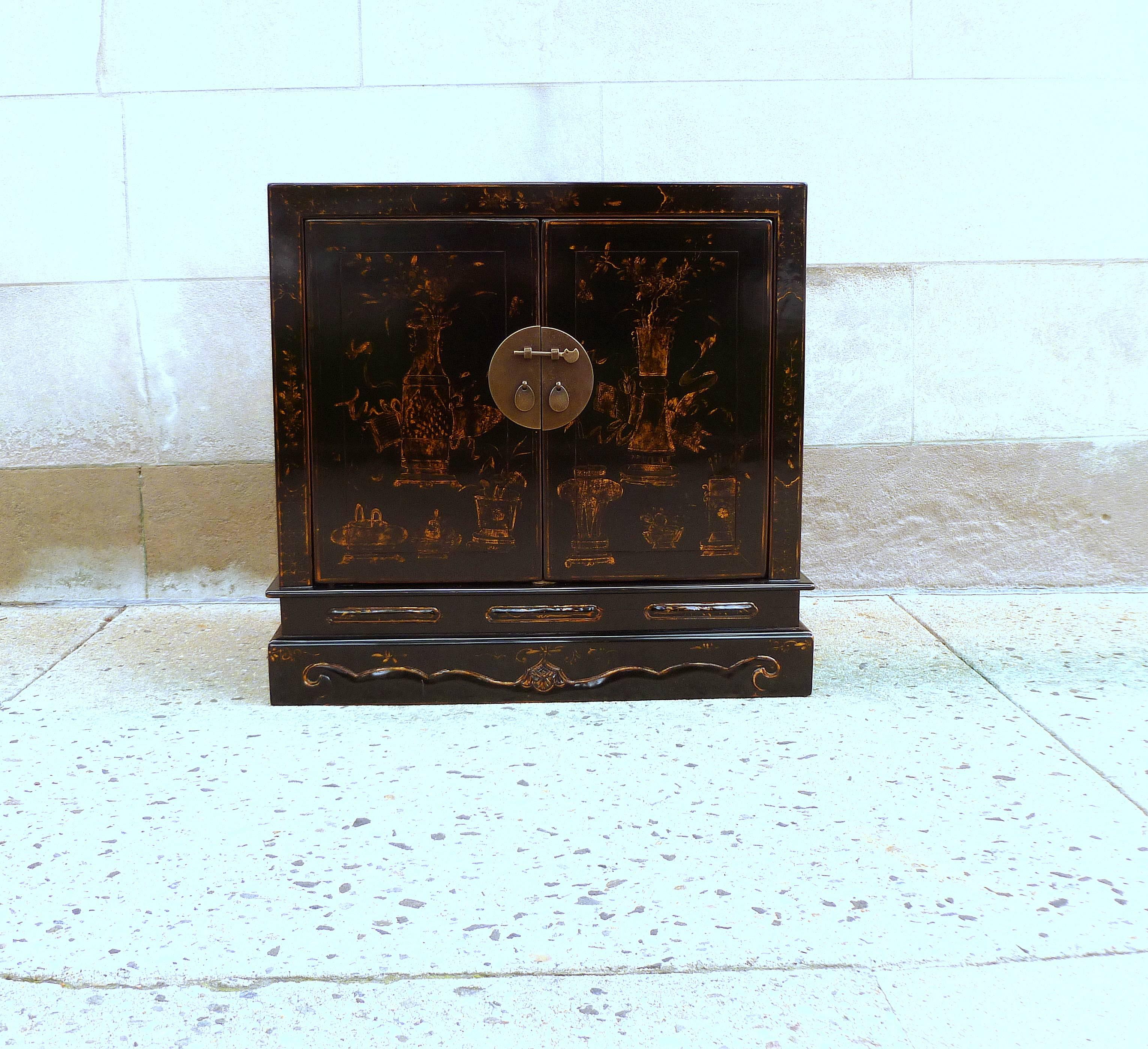 Fine black lacquer chest with gilt motif. Beautiful form and color, elegant piece.