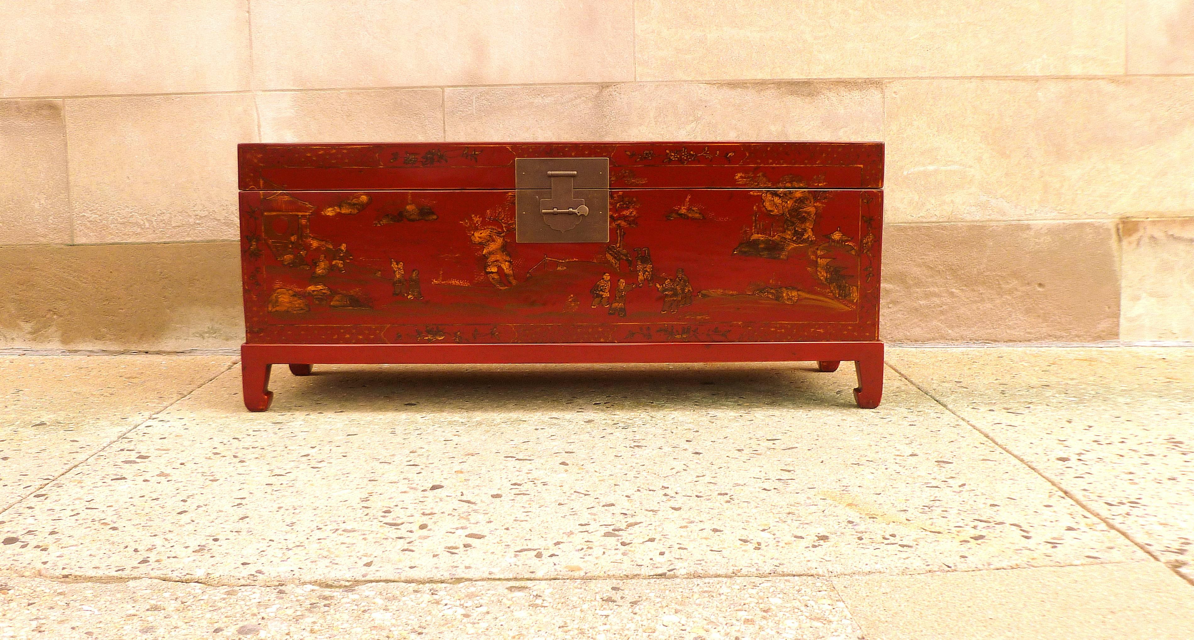 Fine red lacquer trunk with gilt landscape motif, beautiful color finished and form, trunk on stand.  We carry fine quality furniture with elegant finished and has been appeared many times in 