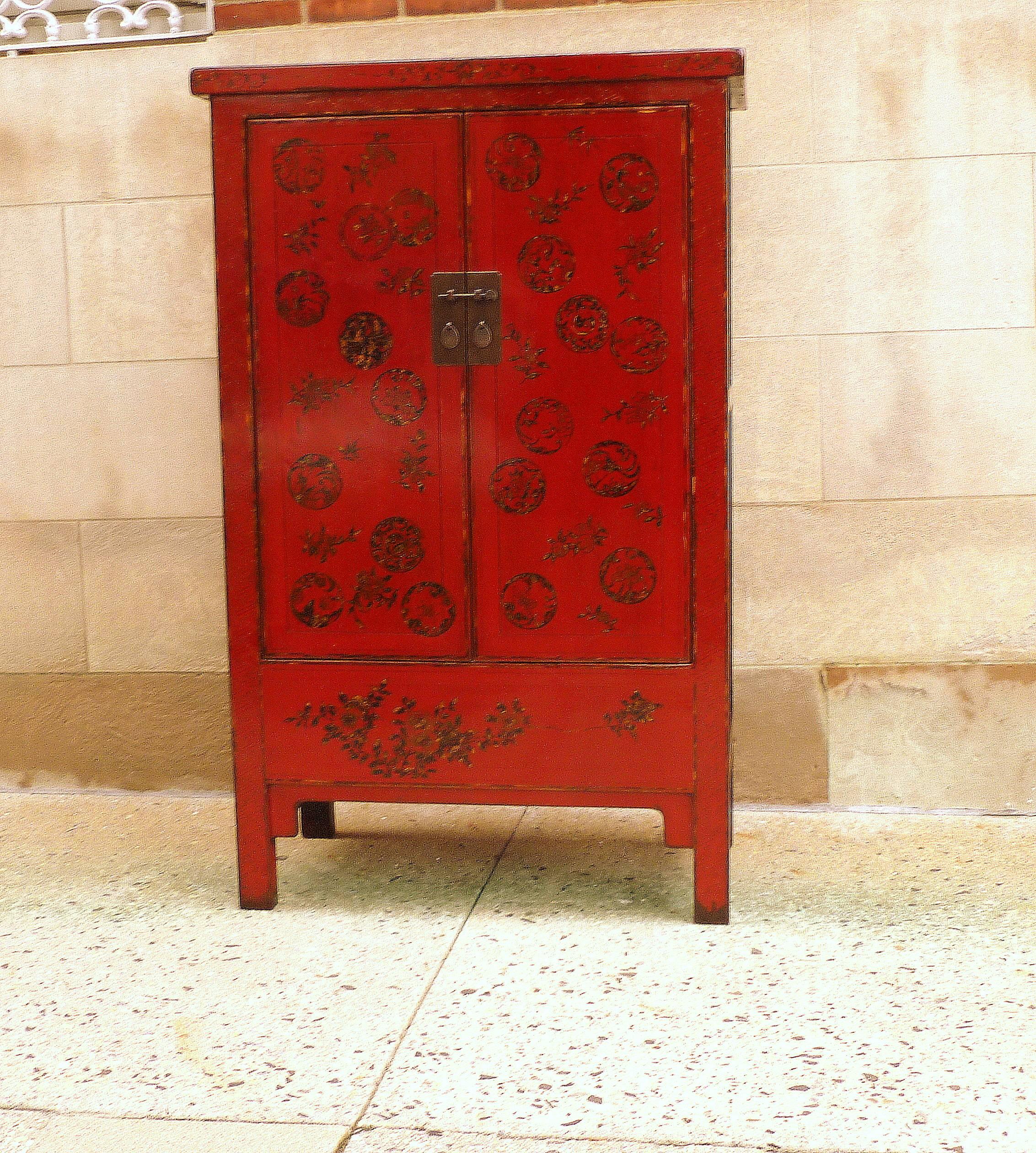 Fine red lacquer armoire with gold motif, elegant and beautiful color.