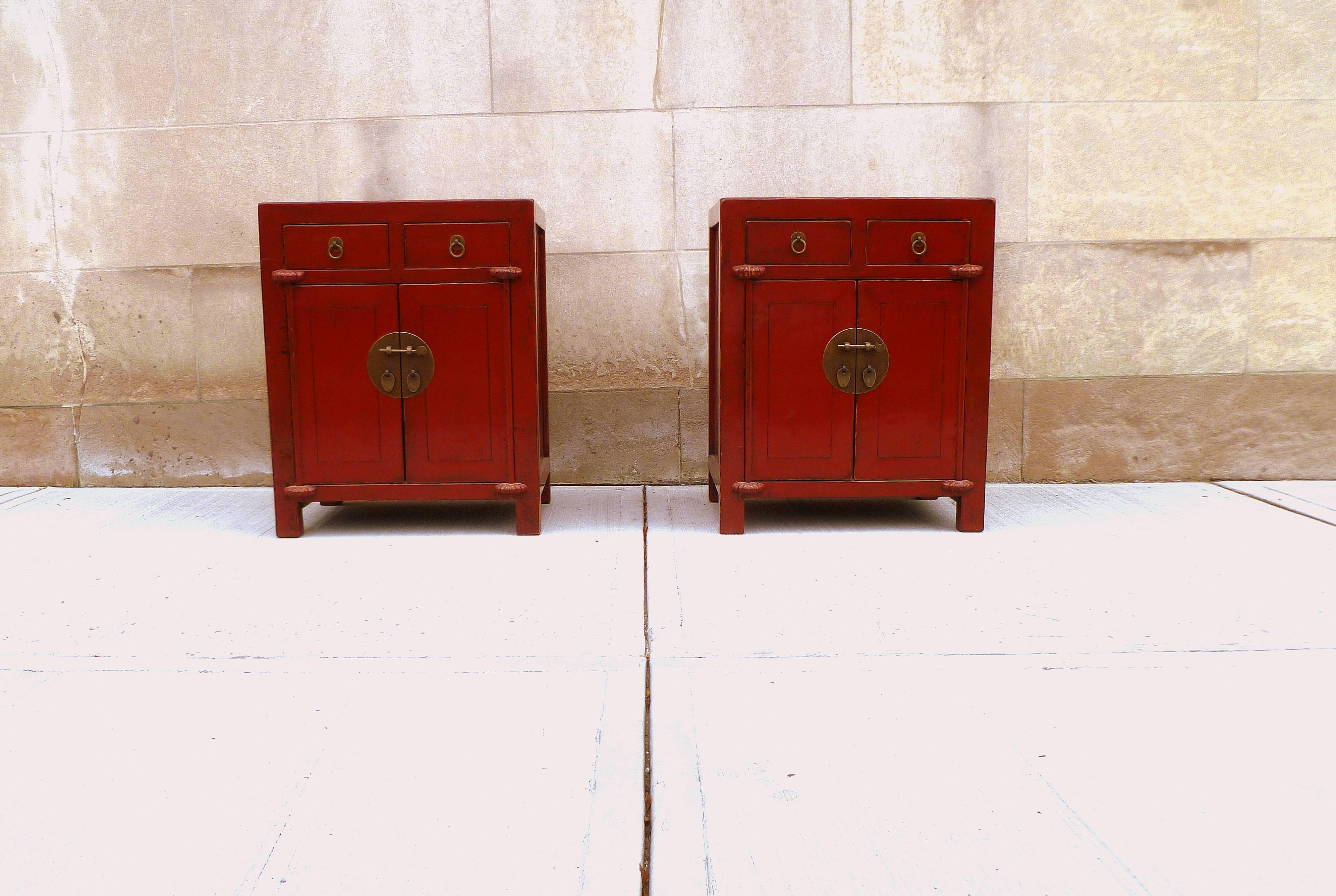 A pair of beautiful red lacquer chests with two drawers and a pair of doors, brass fitting.