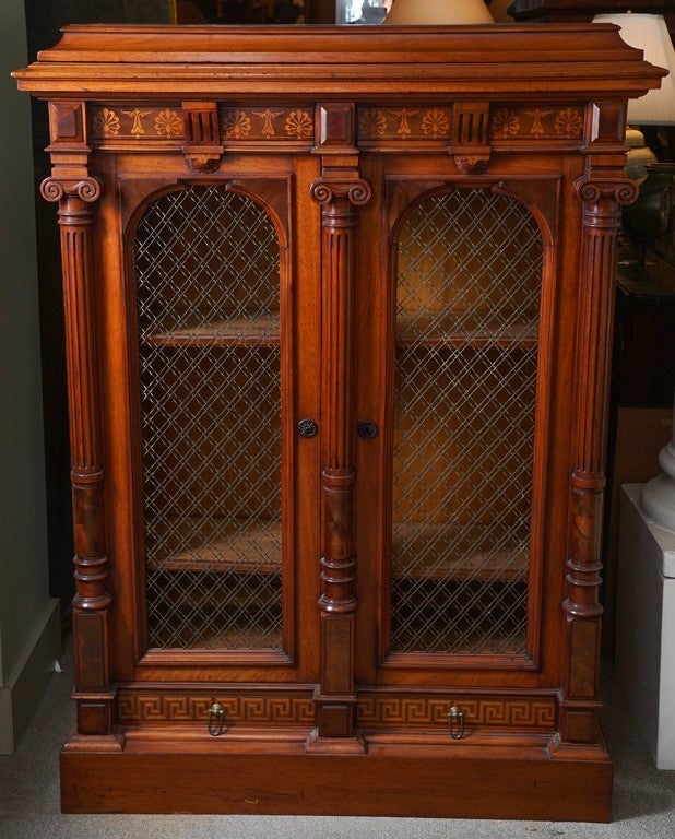 Renaissance Revival cabinet by Herter Brother furniture makers. Original brass grill doors.
