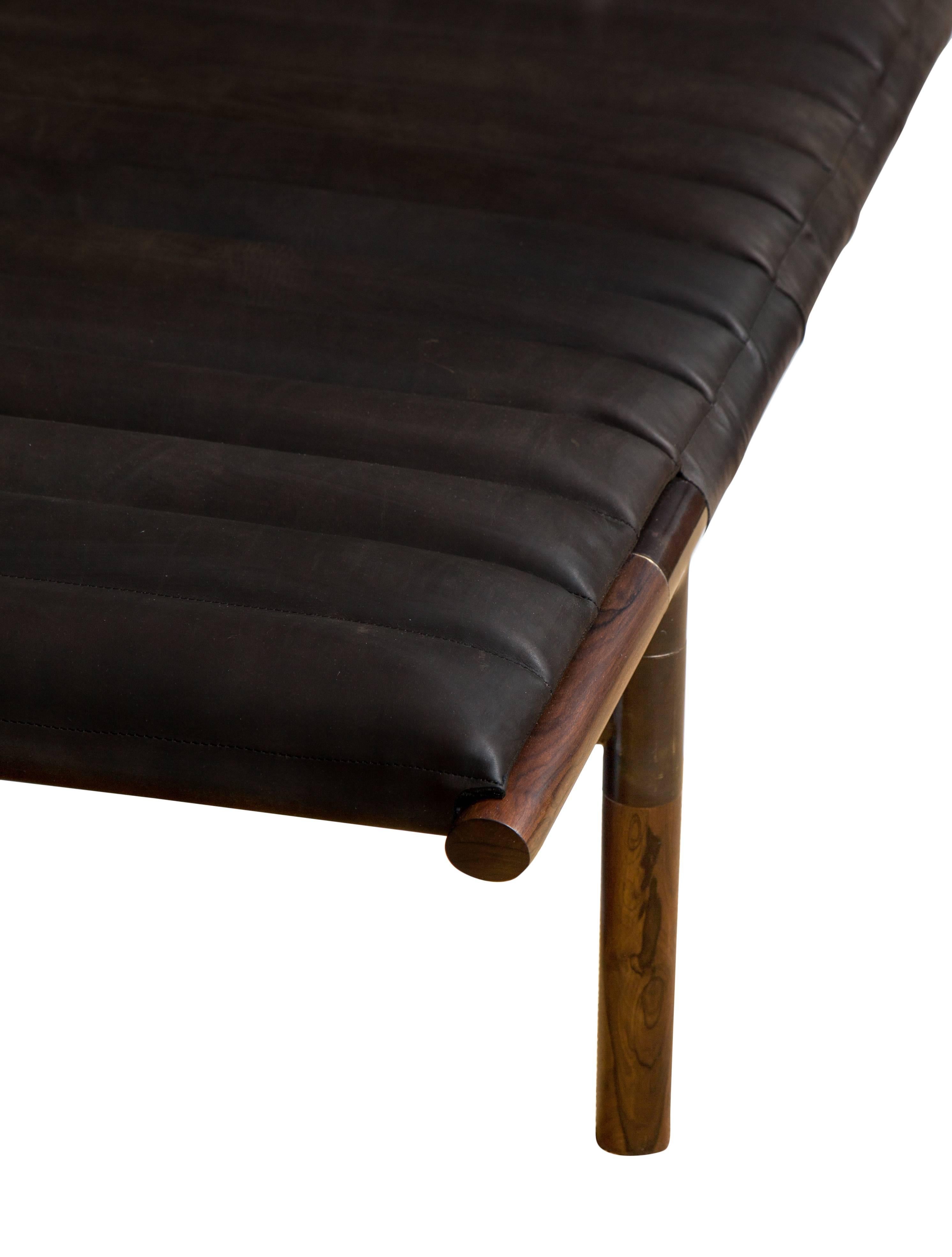 Ebonized rosewood daybed in ribbed Horween leather with blackened brass frame. Designed by Ben Erickson for Erickson Aesthetics .
Custom orders have a lead time of 10-12 weeks FOB NYC. Lead time contingent upon selection of finishes, approval of