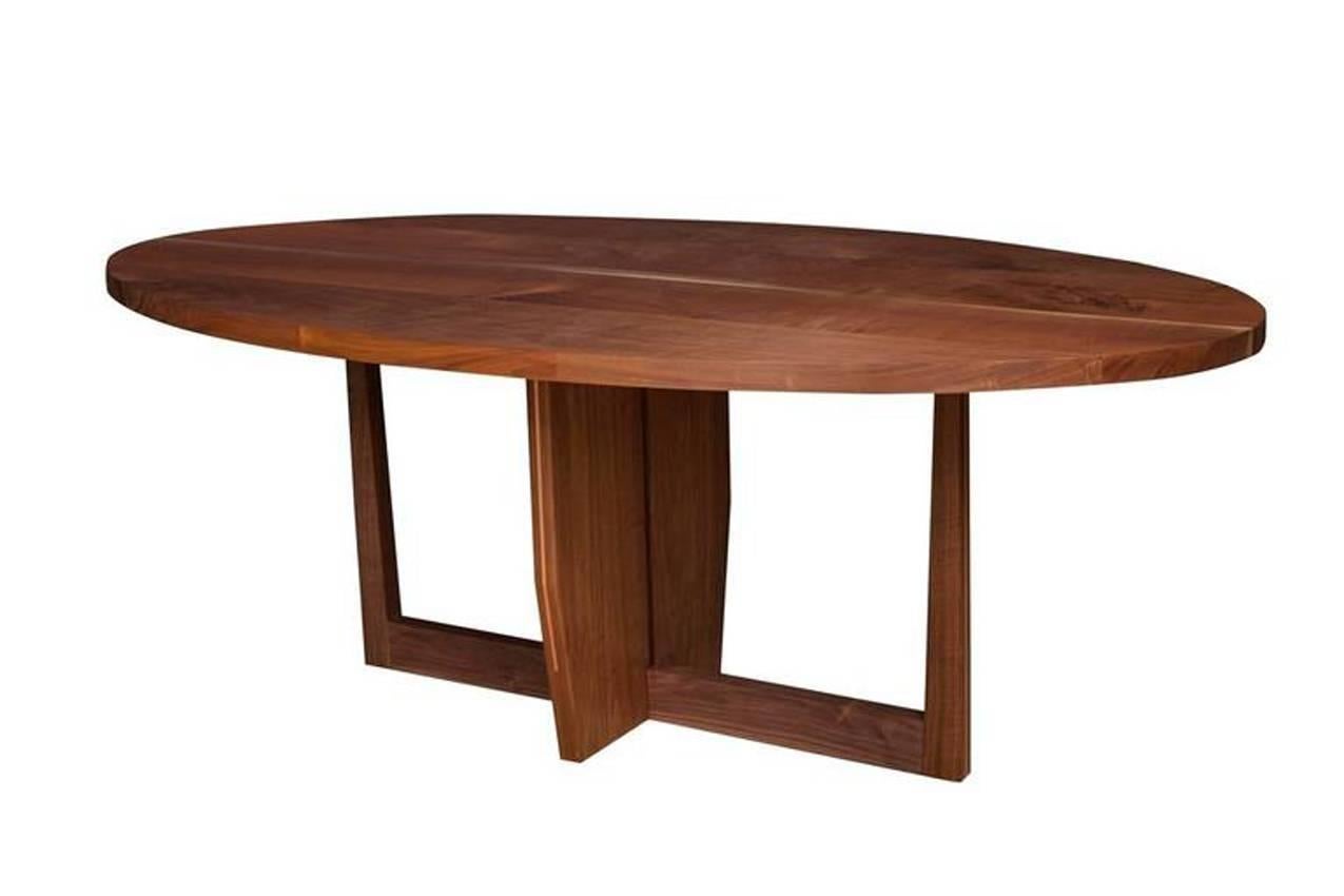Solid American black walnut dining table oil and wax finish with copper detailing by Paul Mignogna for Stillmade.

