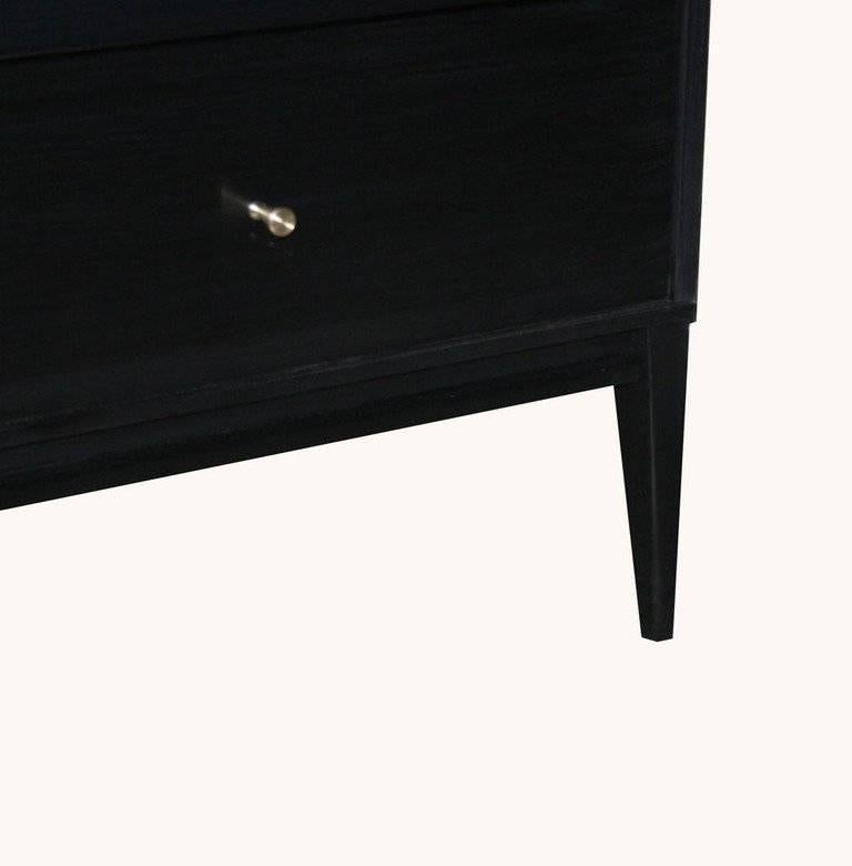 Paul McCobb six-drawer Planner Group dresser. Solid maple construction throughout the dresser has been fully restored in a hand rubbed black lacquer piano finish with original solid brass conical drawer pulls.

Paul McCobb (1917-1969) is an