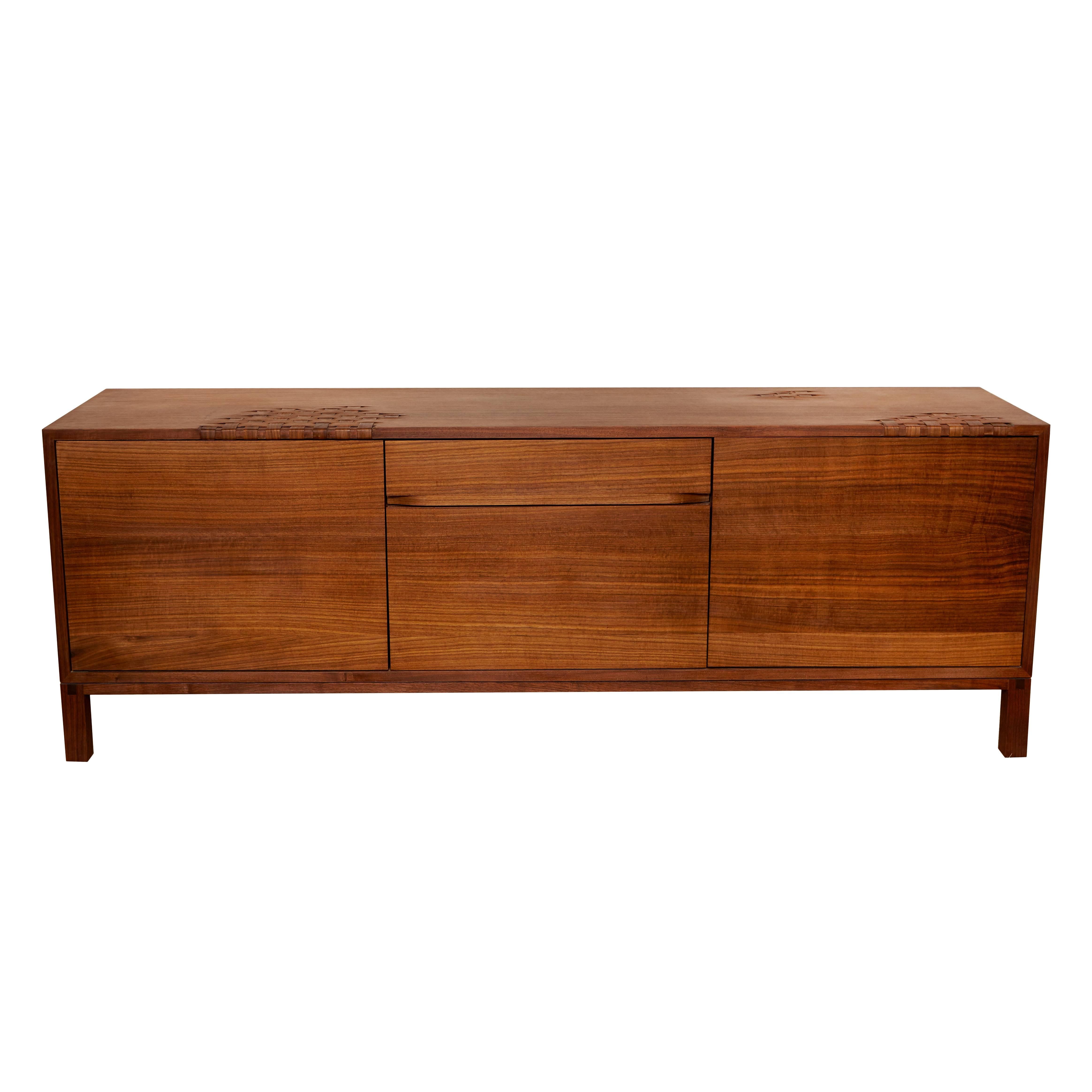 Weave credenza by Don Howell, circa 2016. A simple case piece with a surface that undulates between solid and woven wood with a hand rubbed oil finish.